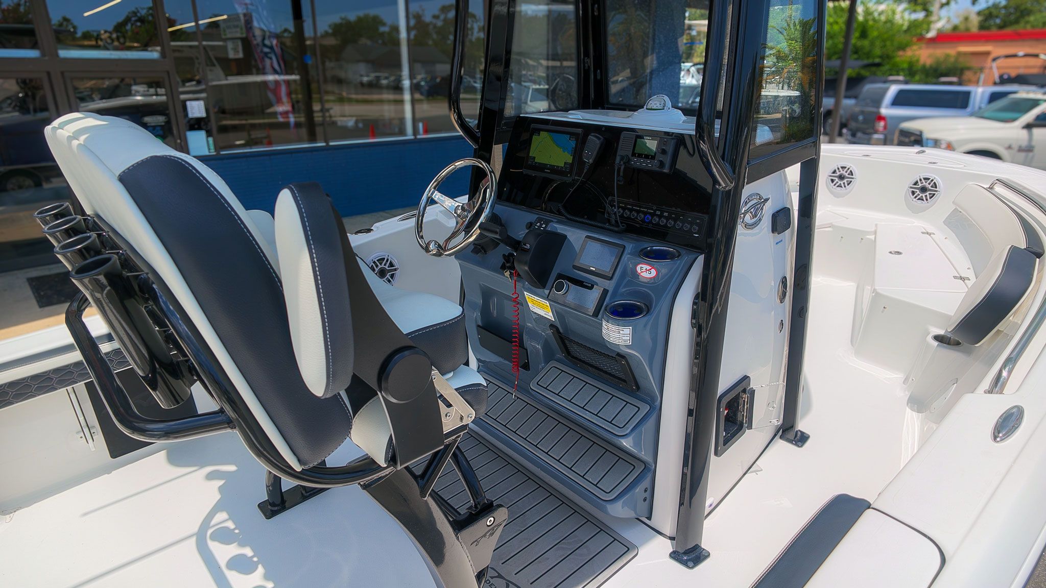 Interior view of a modern boat with helm station and seating.