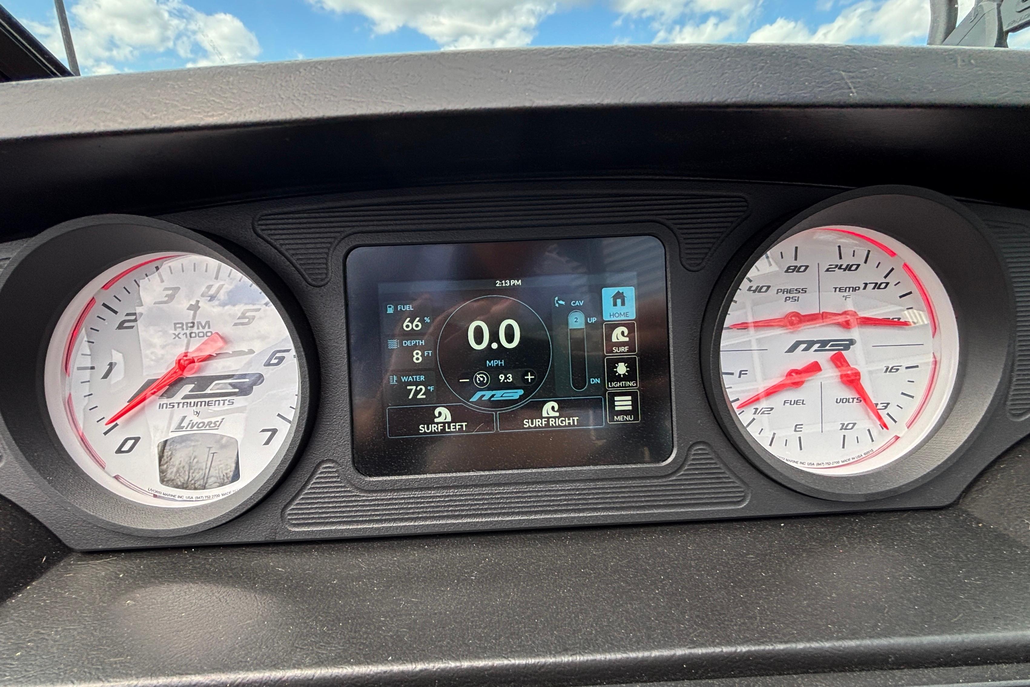 Dashboard of 2026 MB B52 23 Classic boat with digital and analog gauges.