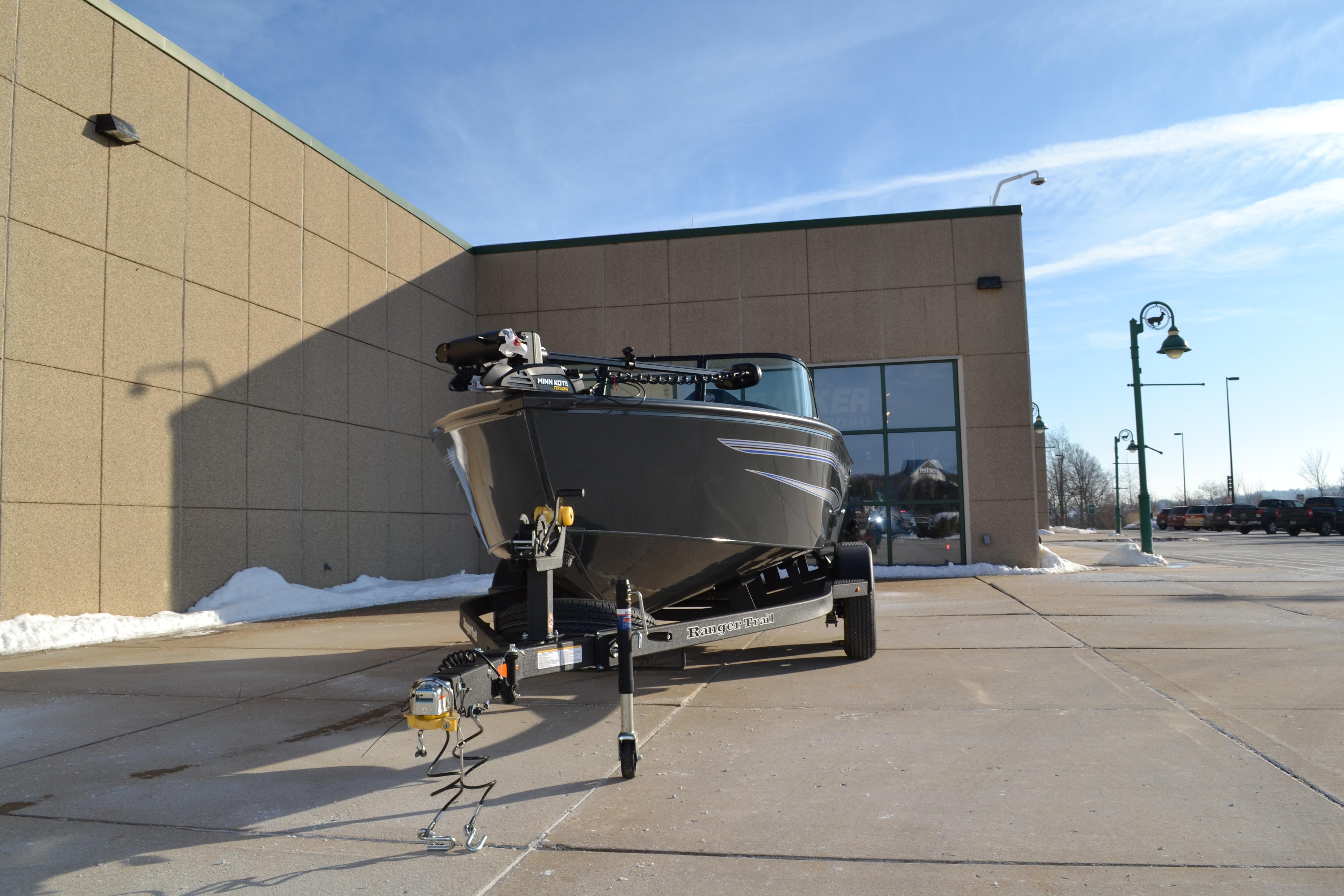 2026 Ranger VS1882SC Reata boat on trailer outside building under clear sky.