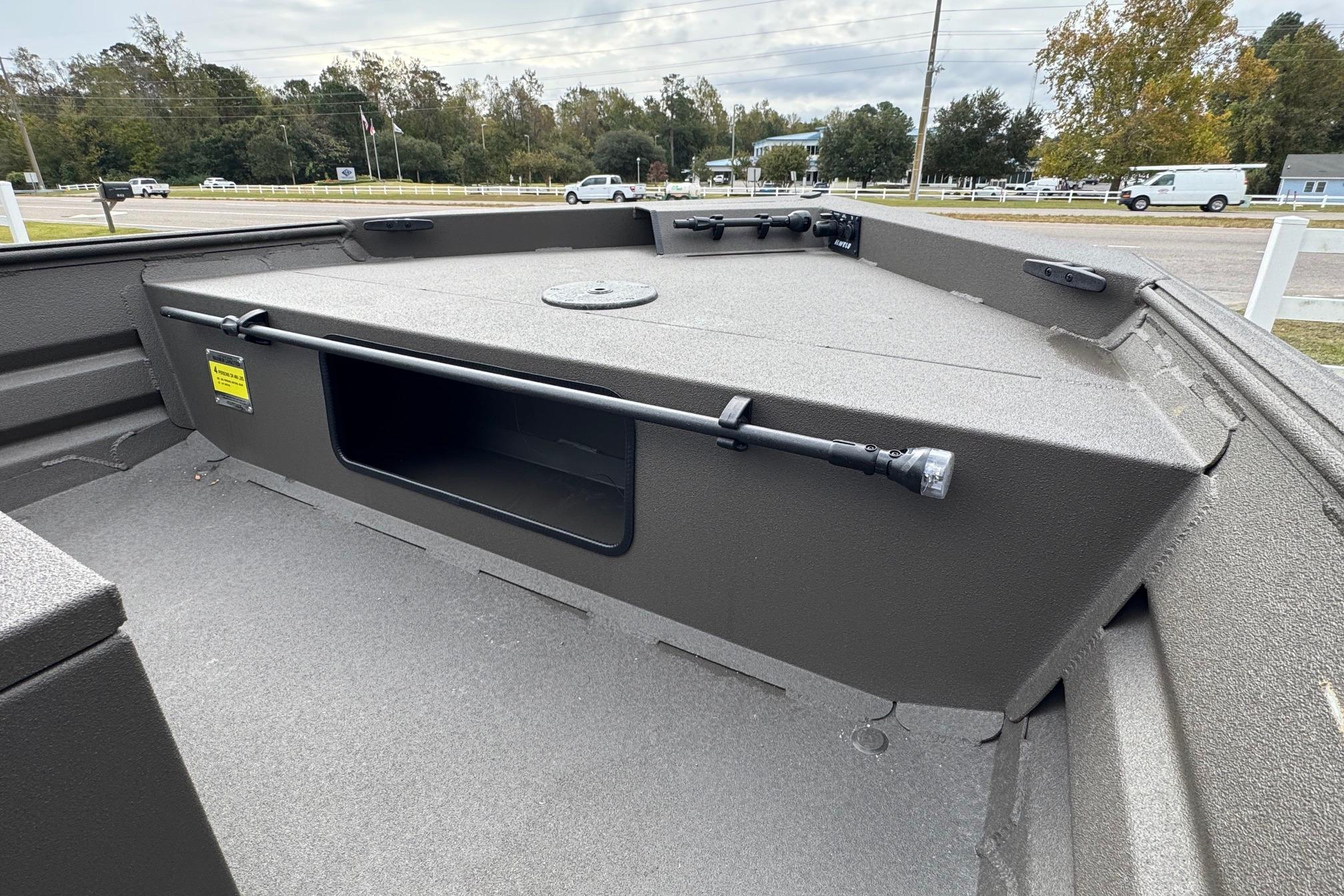 2026 Alweld 1656VV Marsh Console CC boat interior with storage compartment.