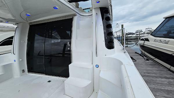 2000 Carver 450 Voyager Pilothouse yacht docked, featuring sleek white exterior and modern design.