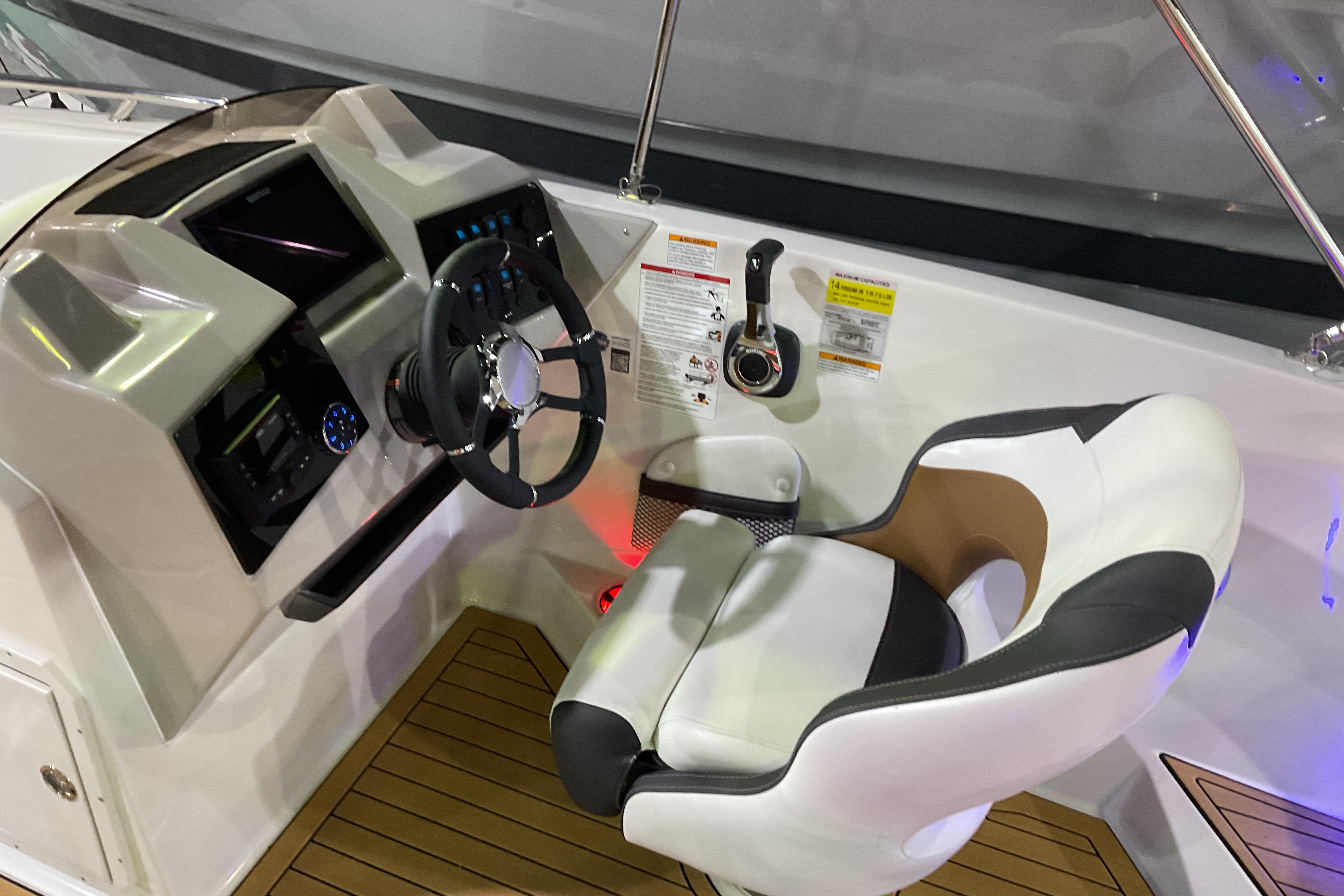 Cockpit of 2026 Starcraft SVX 211 OB boat with modern steering and controls.