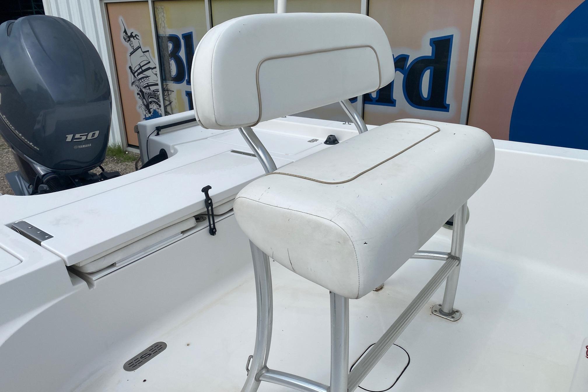 2013 Sportsman Masters 227 Bay Boat with Yamaha 150 engine and white seating.