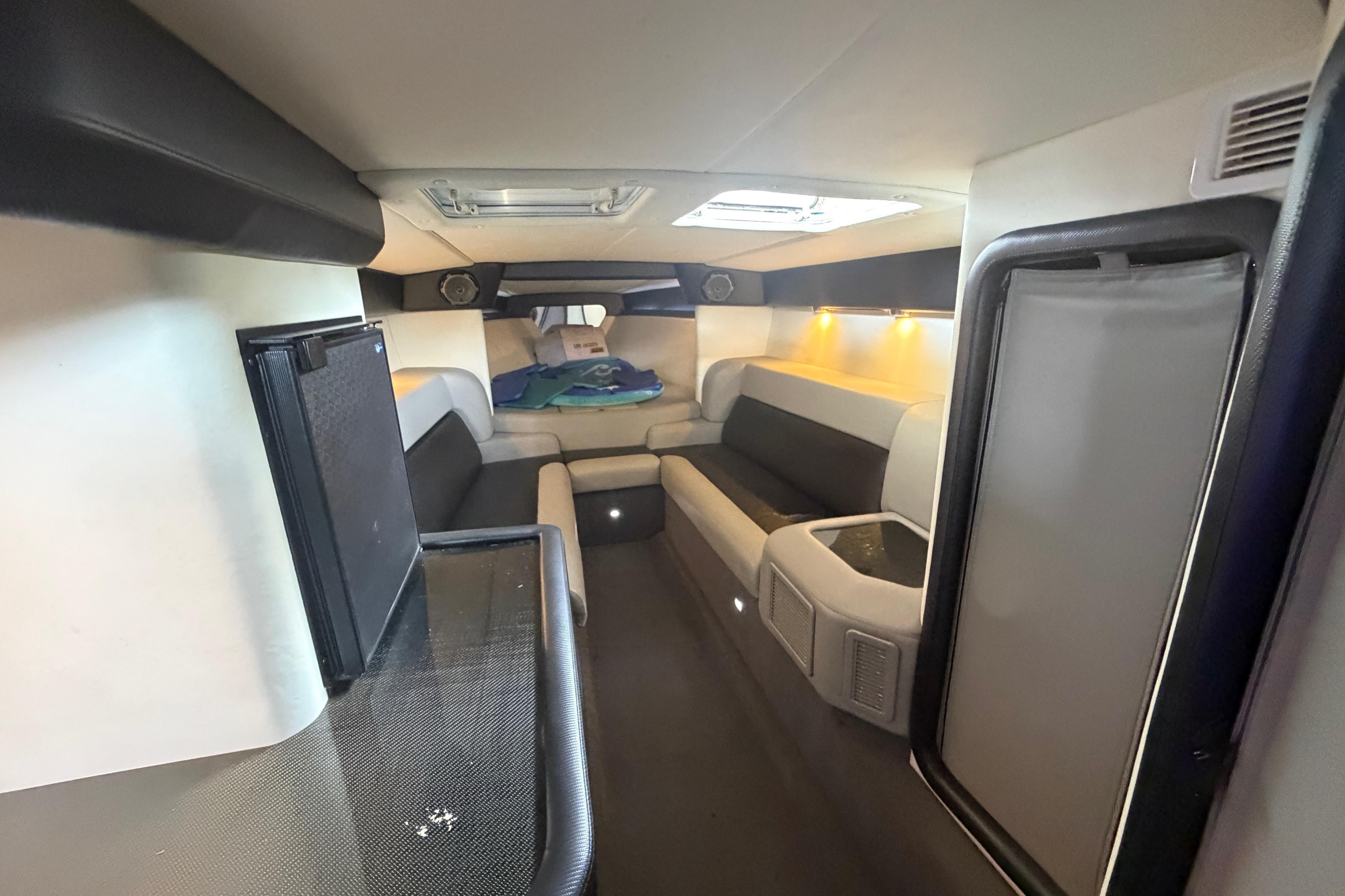 Interior of 2013 Nor-Tech 477 SPX Vee Bottom boat, featuring modern seating and lighting.