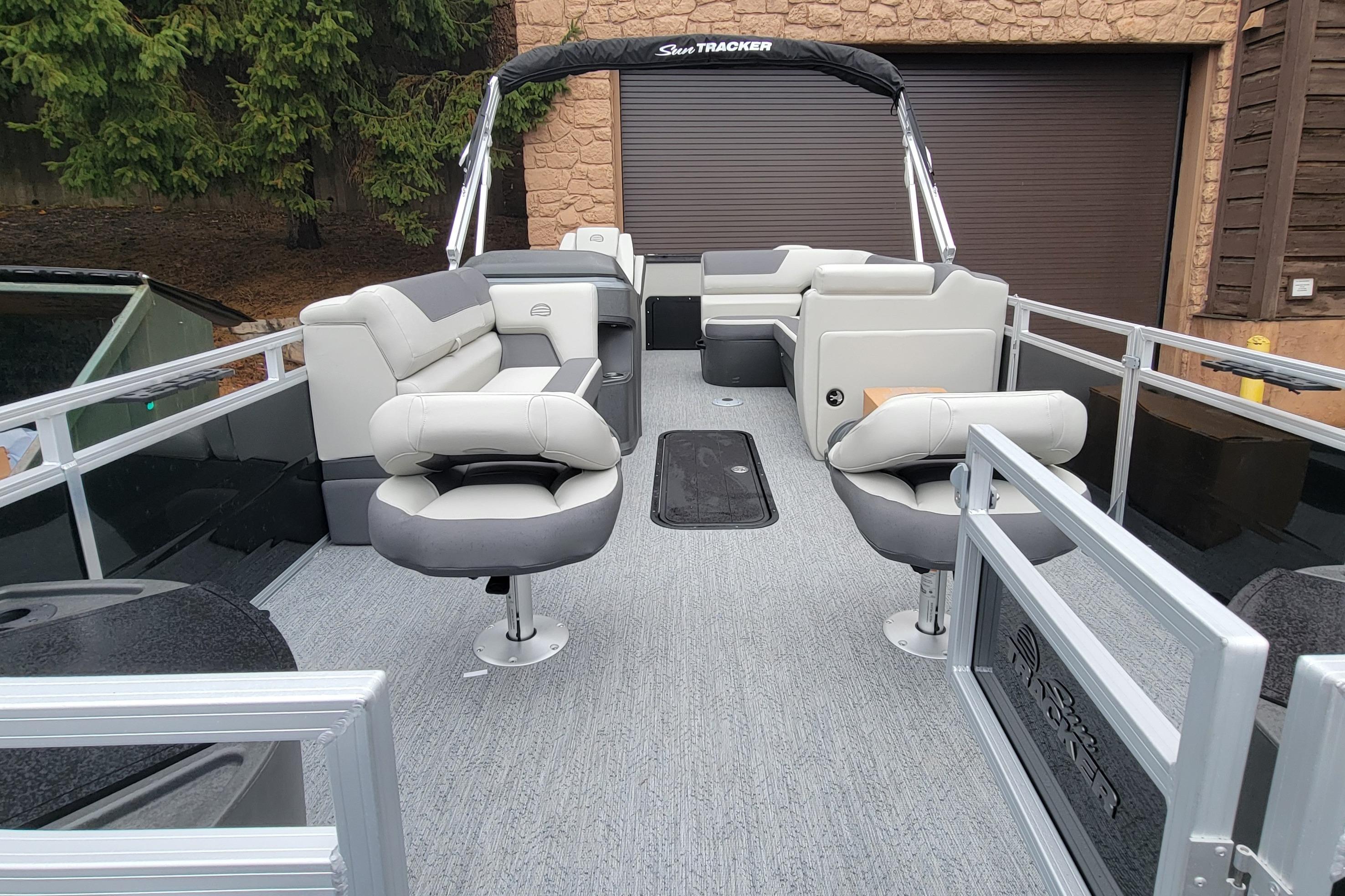2026 Sun Tracker Fishin' Barge 22 XP3 pontoon boat with spacious seating and modern design.