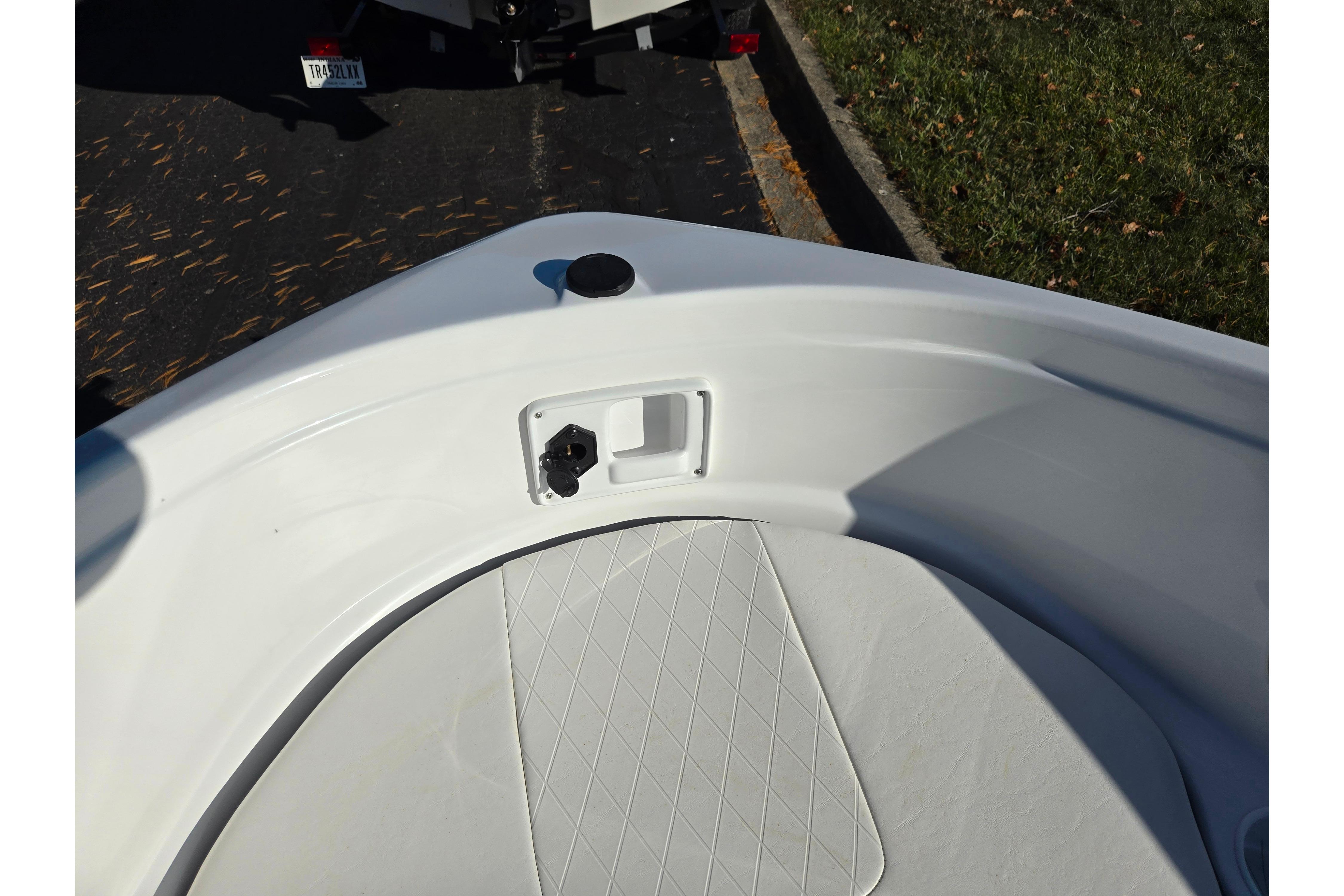 2023 Tahoe 185 S boat interior with white seating and storage compartment.
