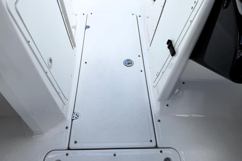 2017 Yamaha Boats SX210 interior deck with storage compartment and white finish.
