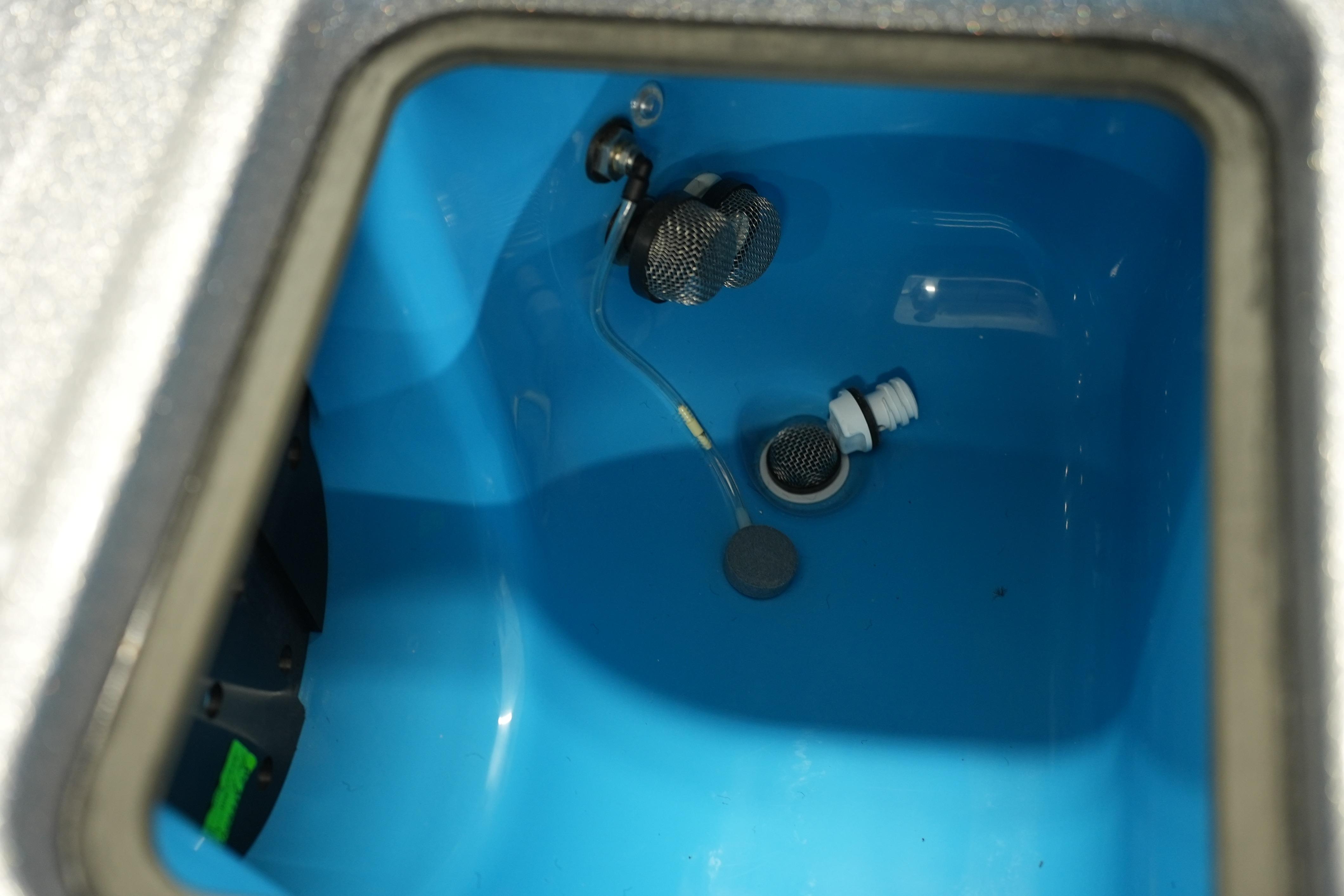 Interior view of iKon LXE20 (2026) blue compartment with metal fittings and wiring.