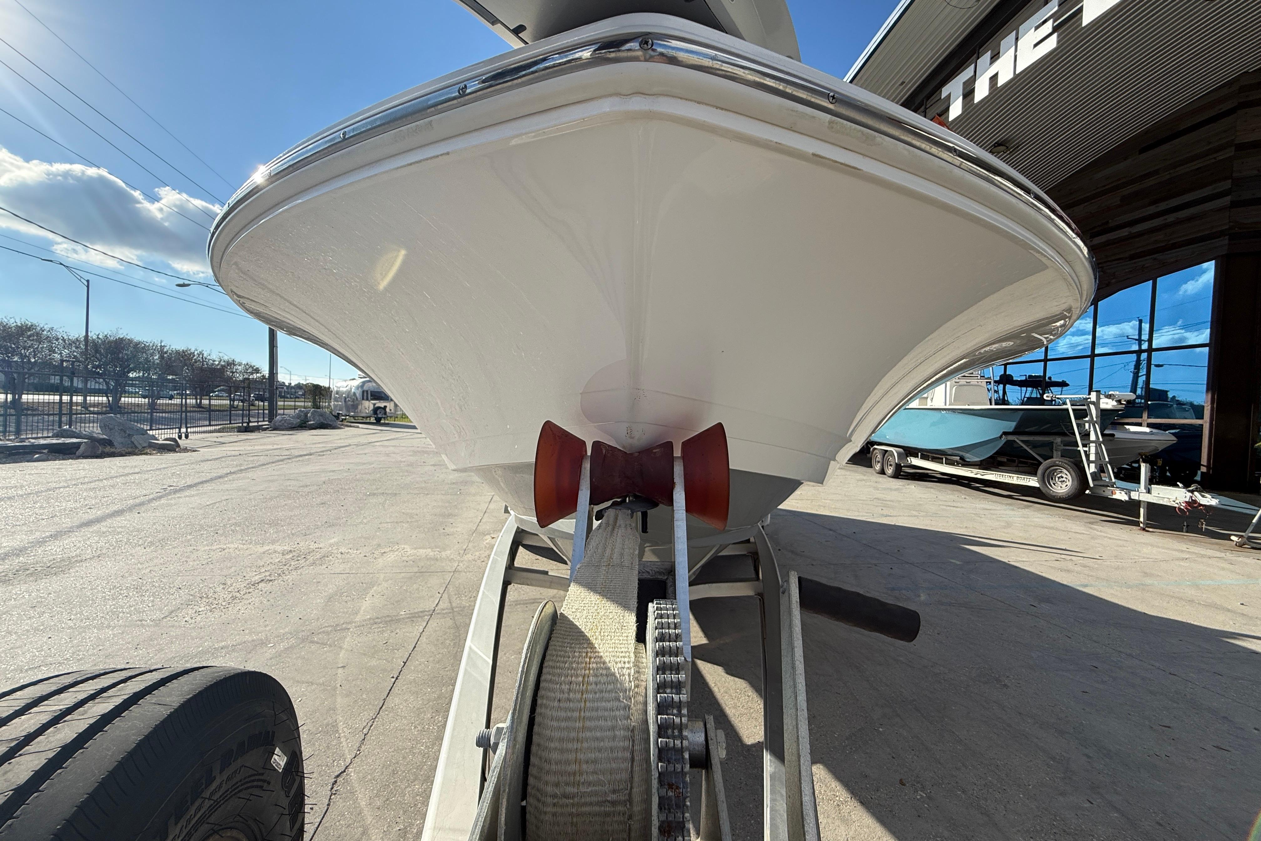 2022 Caymas 28 HB Twin boat on trailer, viewed from below, sunny day.
