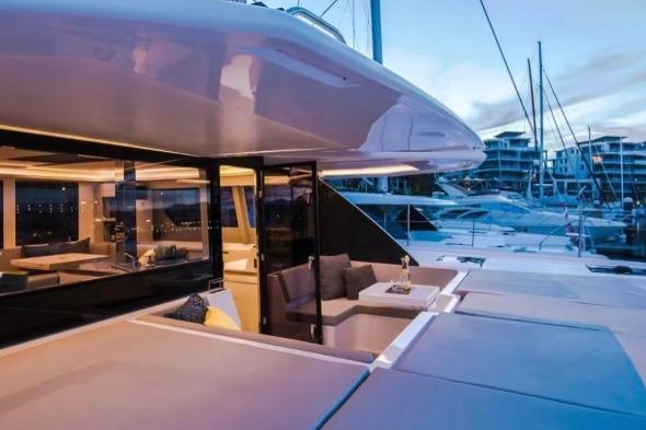 Luxurious 2022 Leopard 50 yacht with modern interior at marina during sunset.
