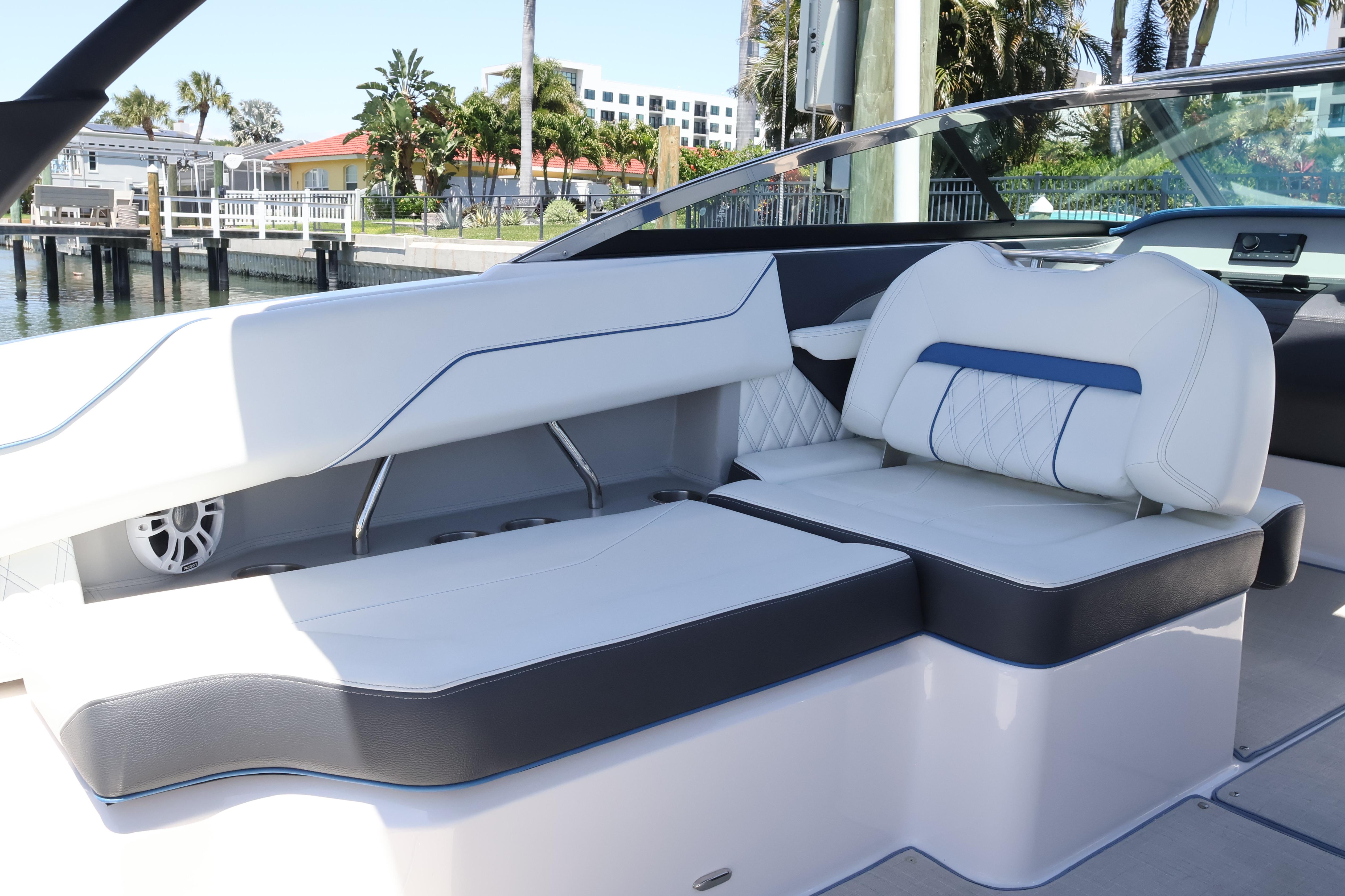 2020 Regal LX4 boat interior with white and blue seating, dockside view.