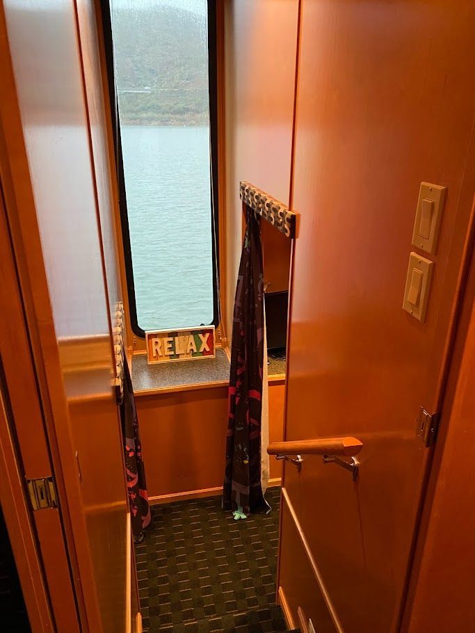Interior of a 2006 Summersun Houseboats 16x68 with "Relax" sign.