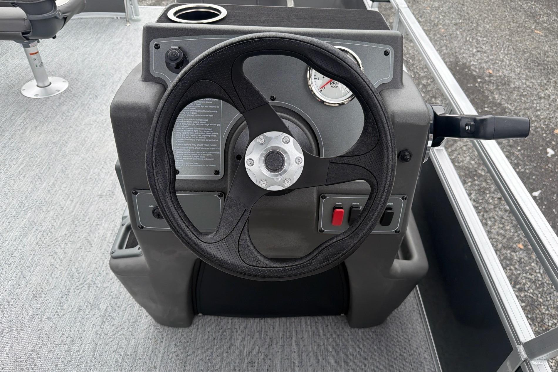 Steering console of 2026 Sun Tracker Bass Buggy 16 XL Select pontoon boat.