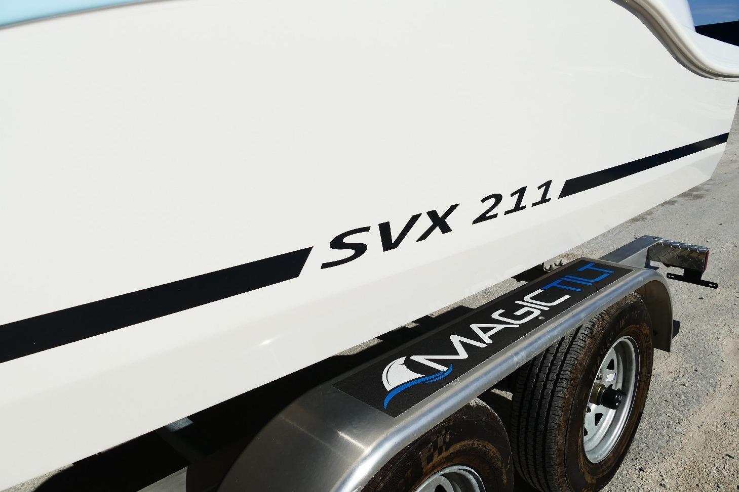 2026 Starcraft SVX 211 OB boat on Magic Tilt trailer, side view.