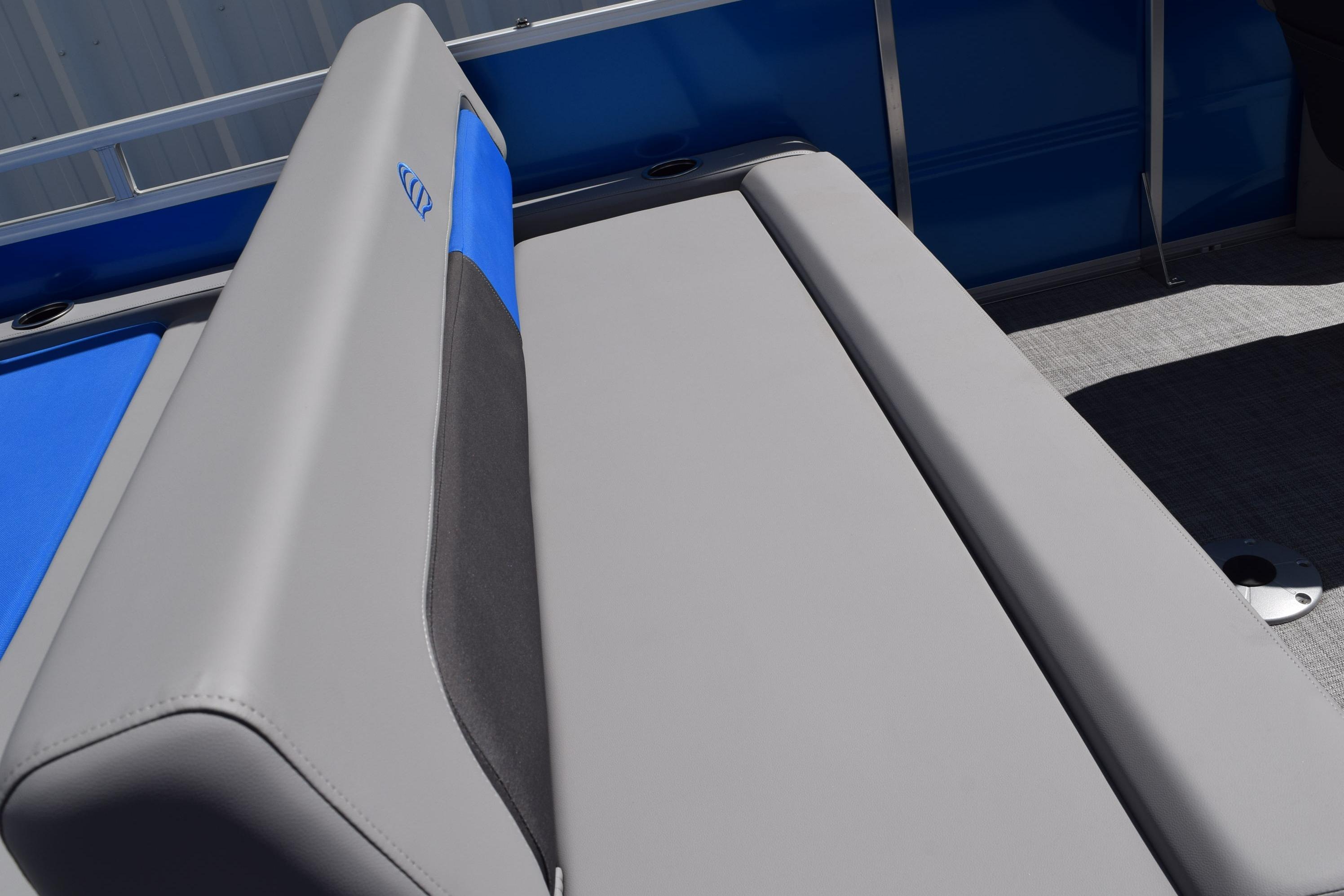 2026 Sun Tracker Party Barge 22 RF DLX, featuring sleek gray and blue seating.