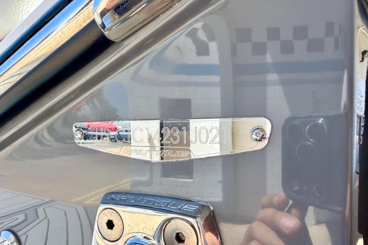 2021 Nautique Super Air Nautique G23 hull identification plate with reflective surface.