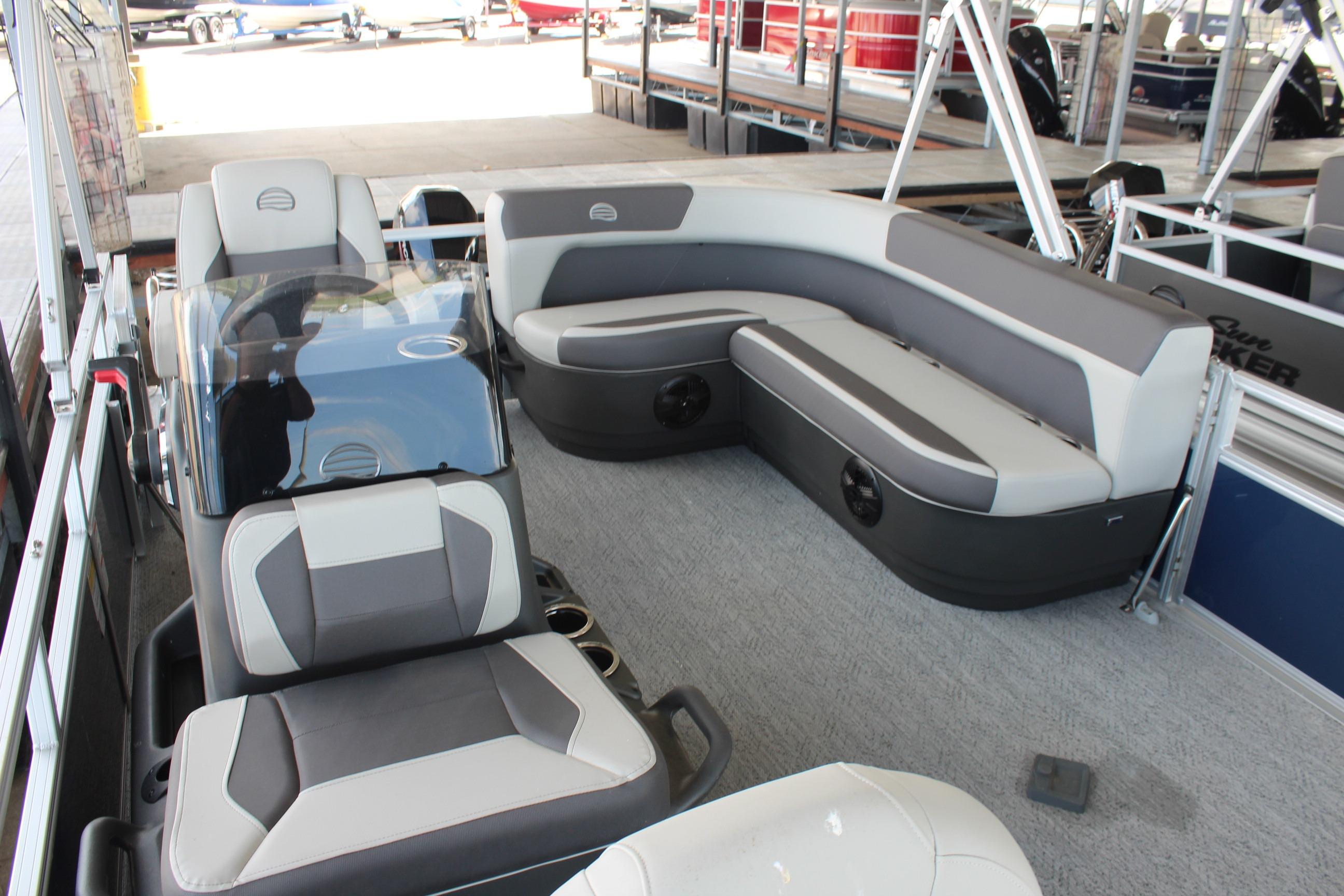 2026 Sun Tracker Bass Buggy 16 XL Select pontoon boat interior with seating and helm.