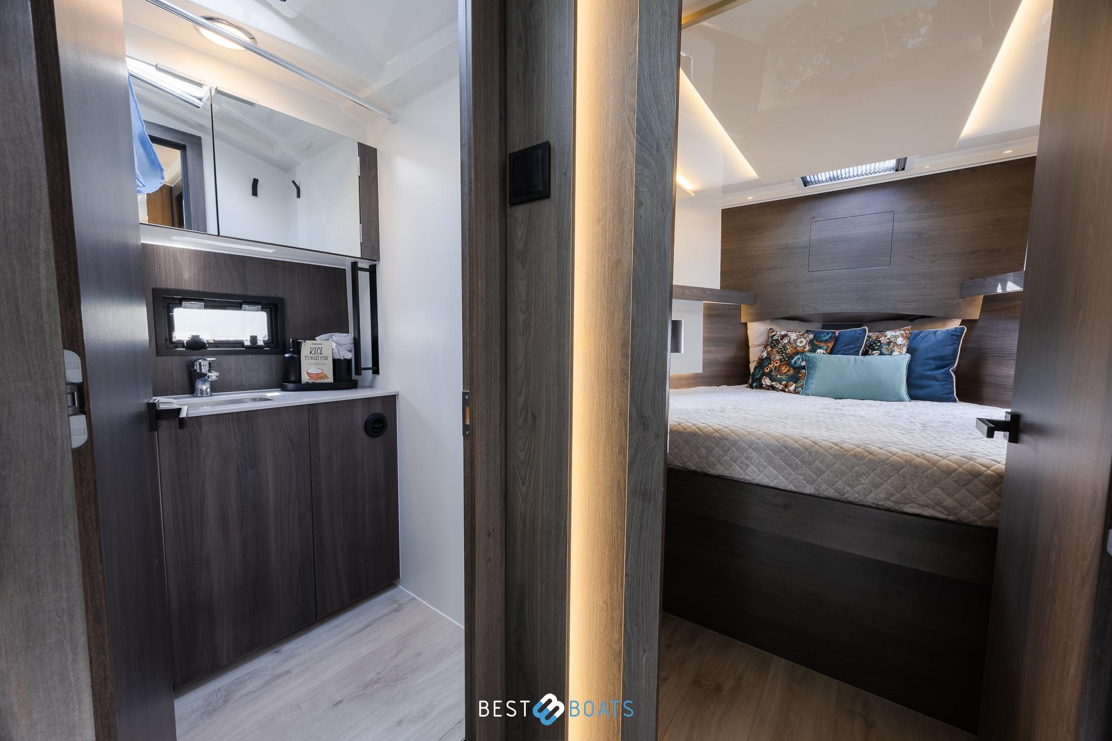 Luxurious interior of 2023 Cobra Yachts Futura 36 Premium Fly, featuring a cozy bedroom and modern bathroom.