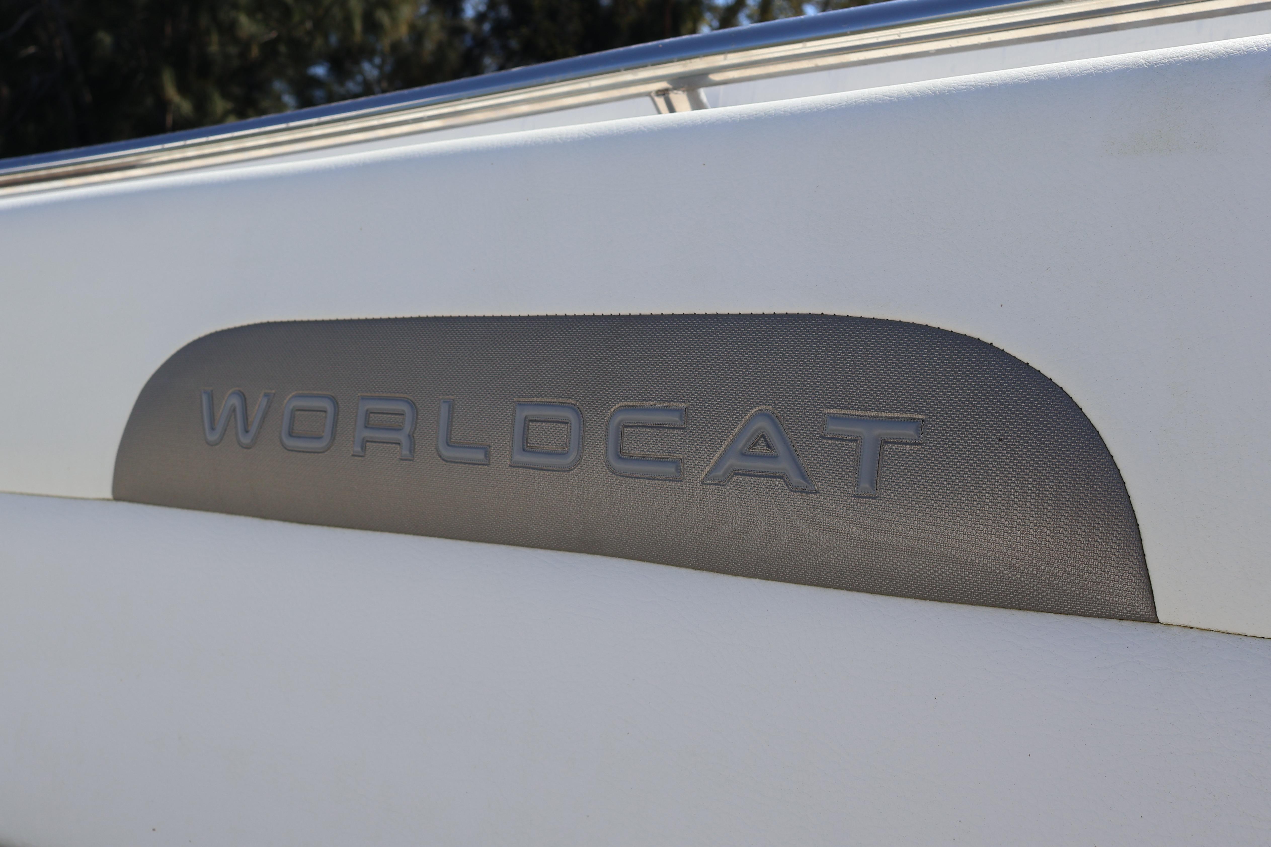 2022 World Cat 280 CC-X boat logo detail on white surface.