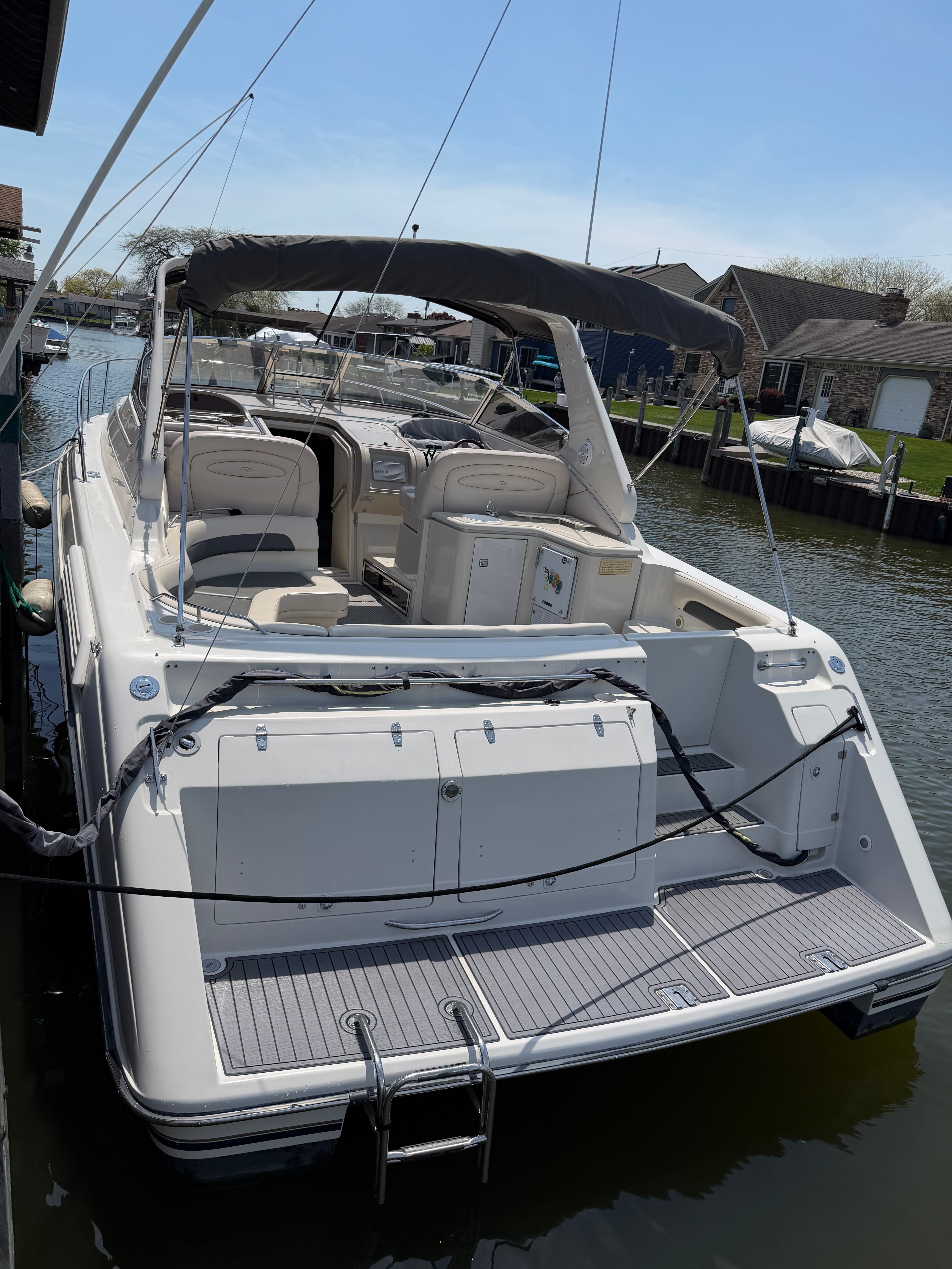 1997 Regal Commodore boat docked on a sunny day.