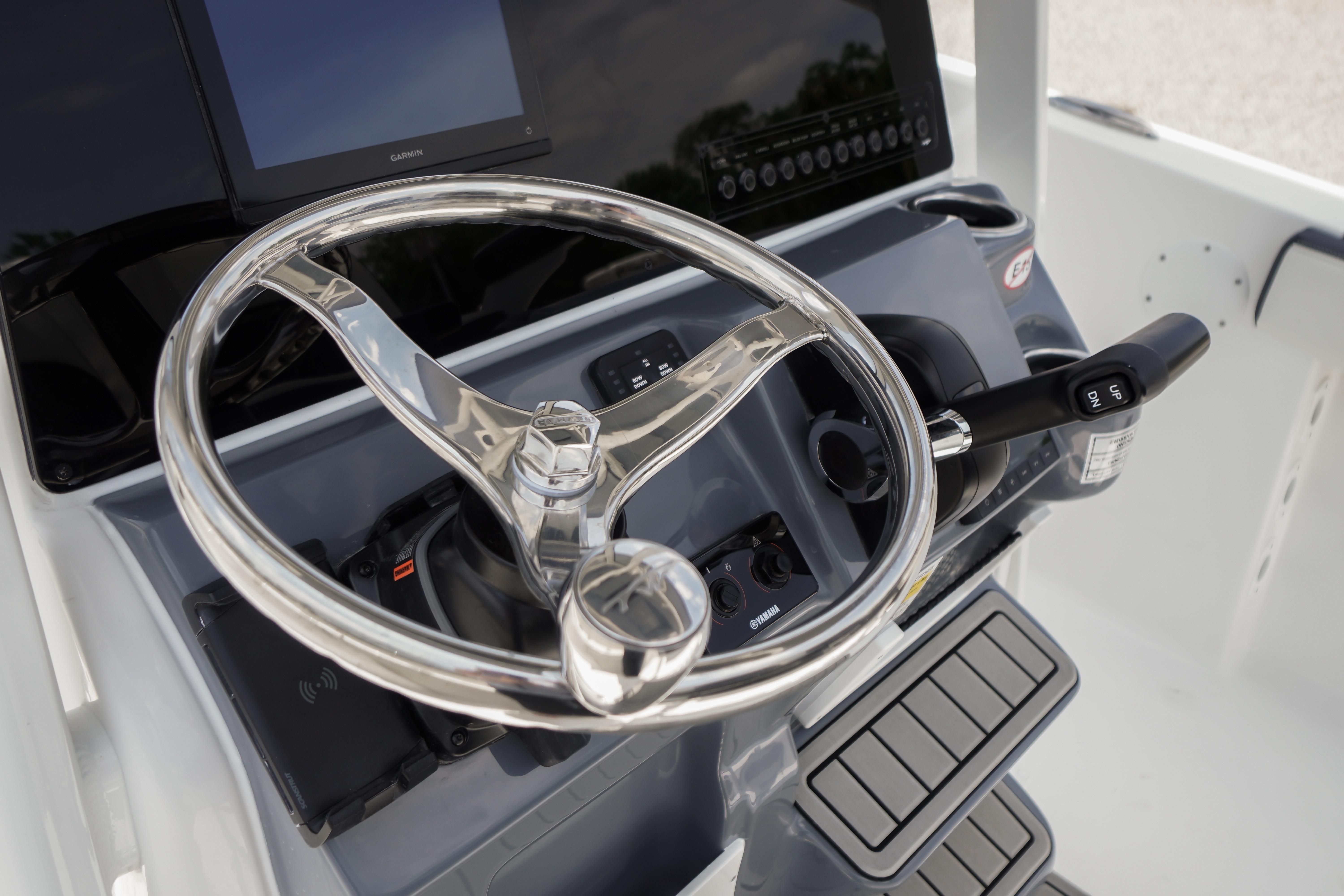 Steering console of 2027 Tidewater 220 CC Adventure boat with modern controls.