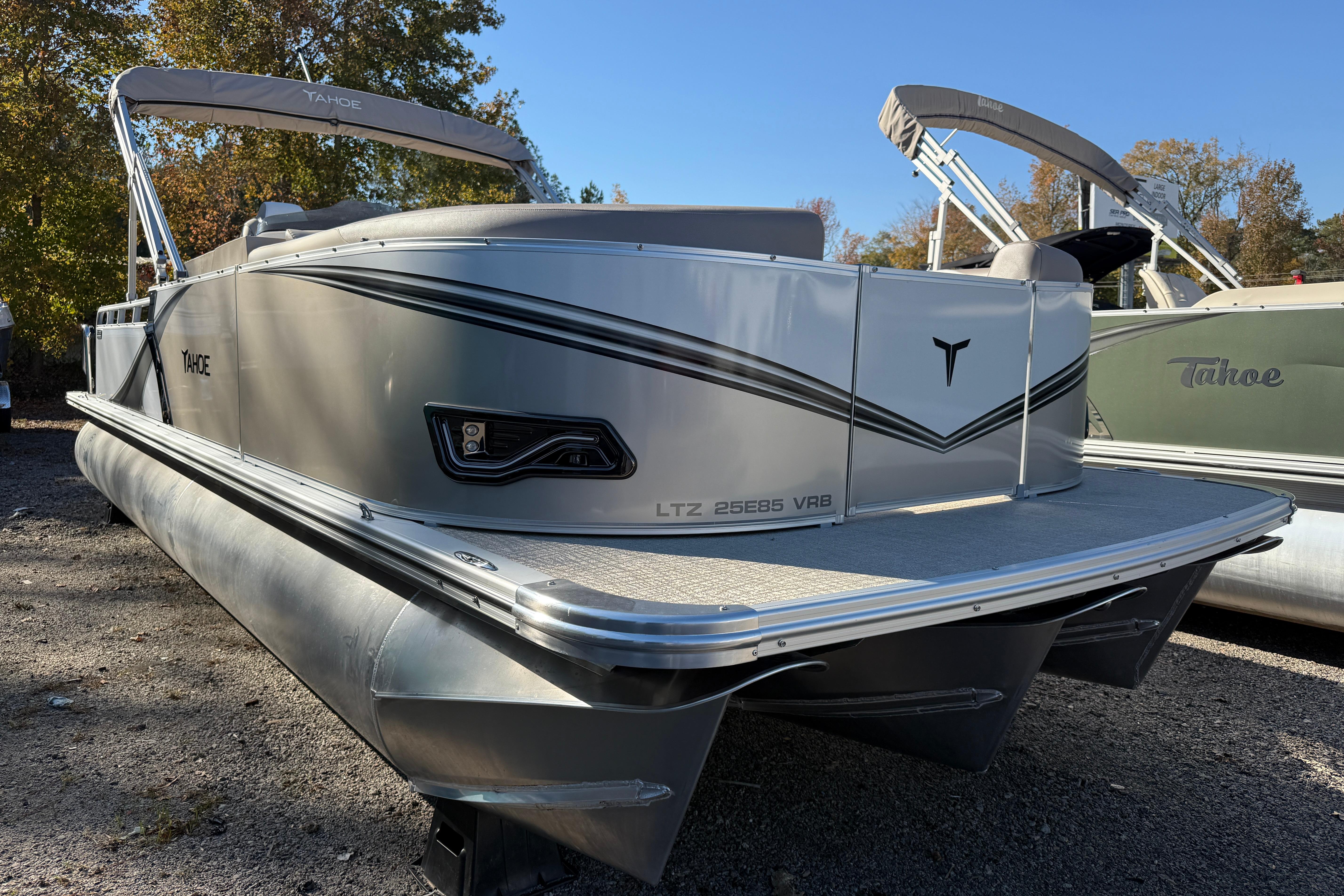 2026 Tahoe Pontoon LTZ Versatile Rear Lounger, silver exterior, parked outdoors.