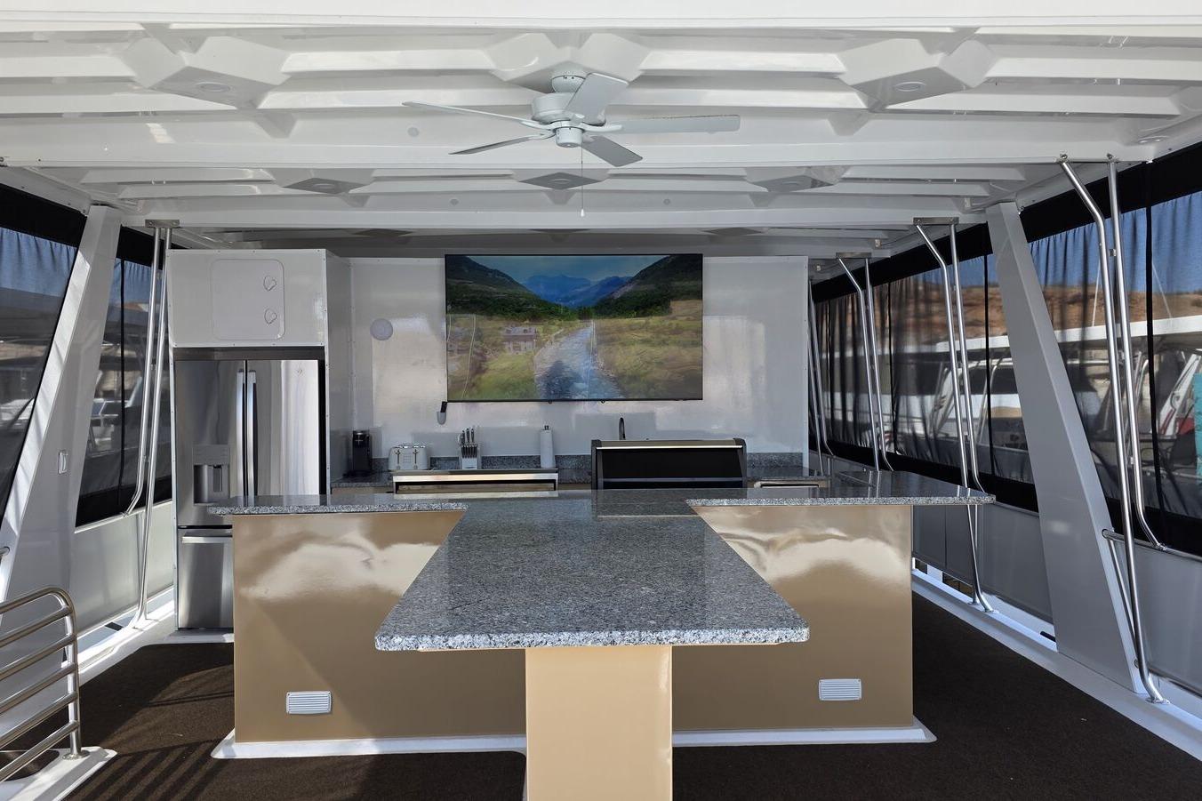Luxurious 2025 Sumerset Excellence yacht interior with modern kitchen and scenic artwork.