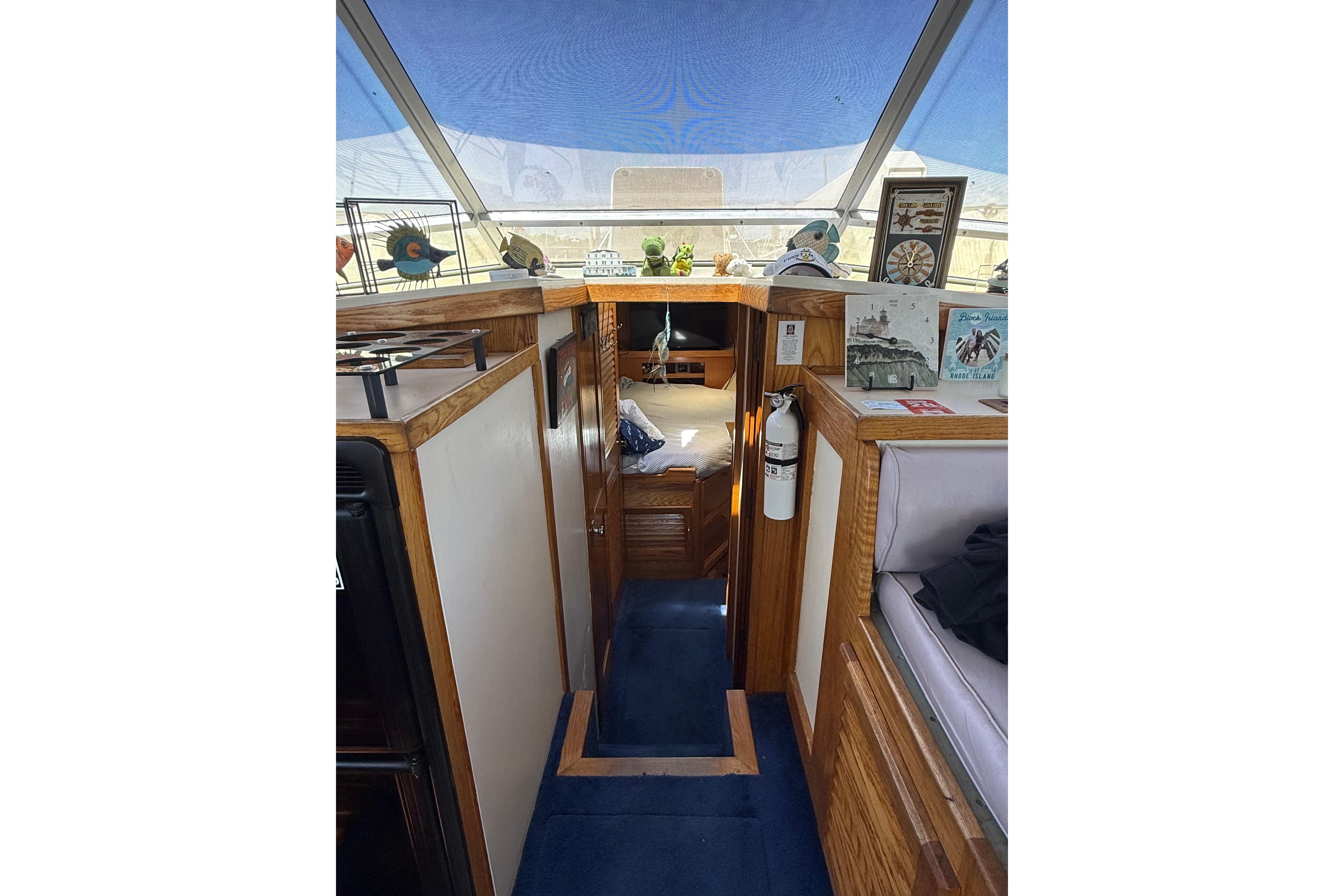 Interior of 1986 Silverton 40 Convertible yacht with wood accents and nautical decor.