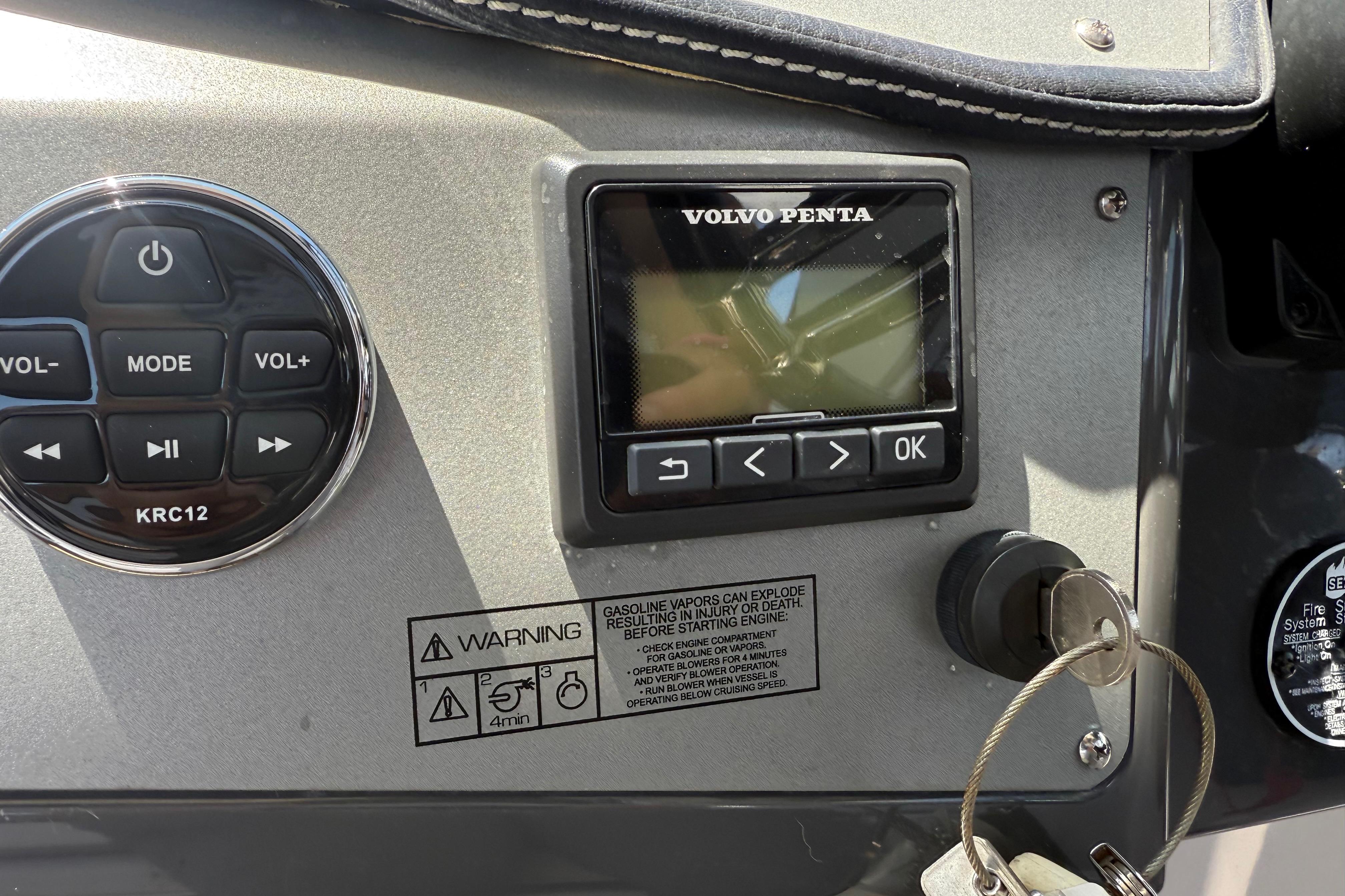 Control panel of a 2017 Four Winns V275 boat with Volvo Penta display and keys.