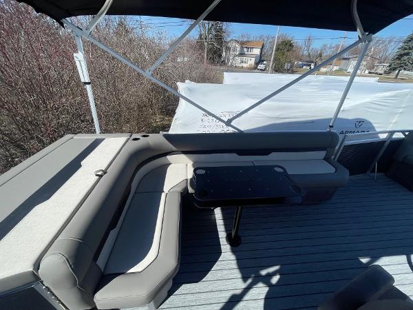 Armada Saphir 23CR 2025 boat interior with cushioned seating and table.