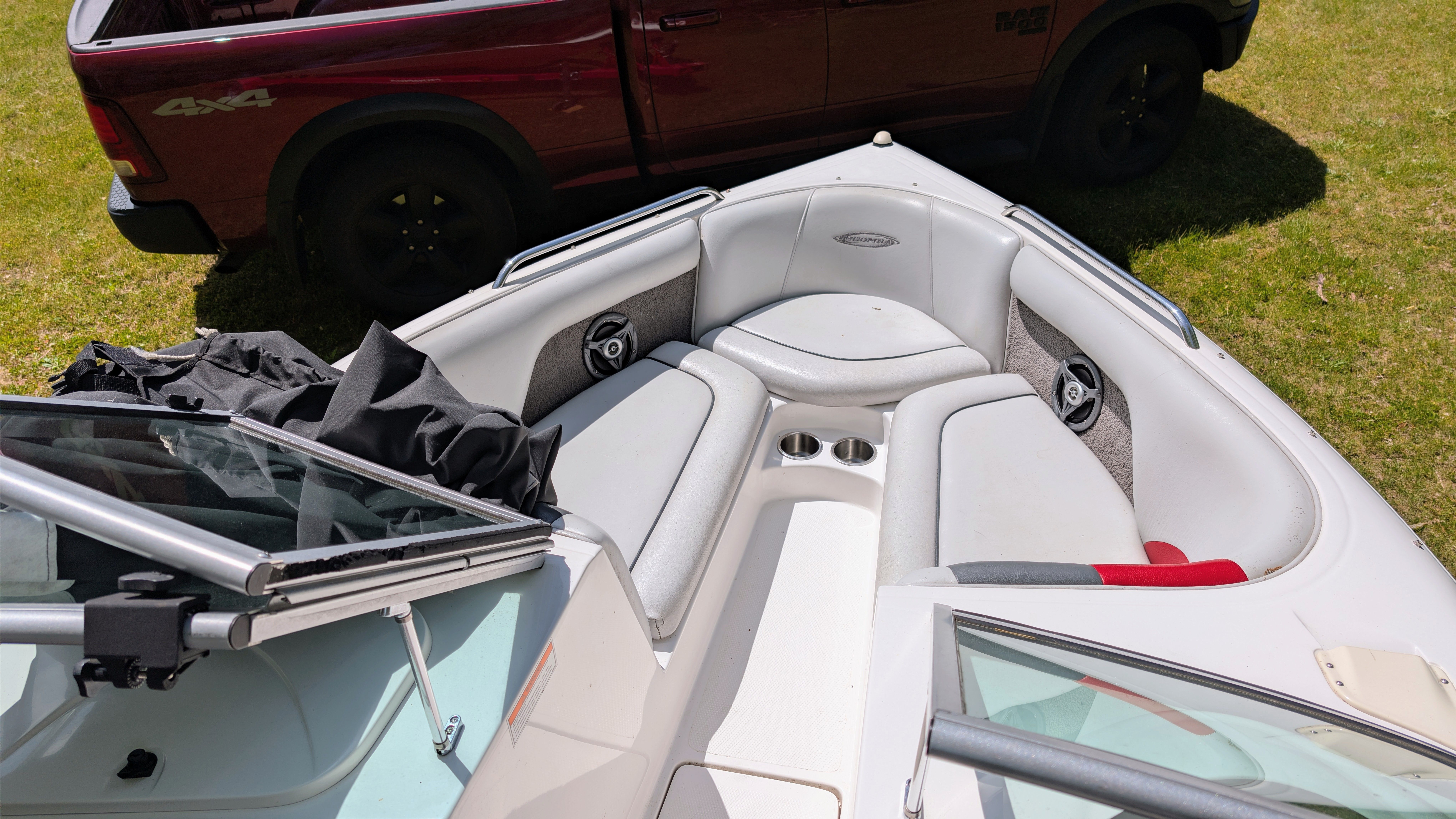 2007 Moomba Outback V boat interior with red truck in background.