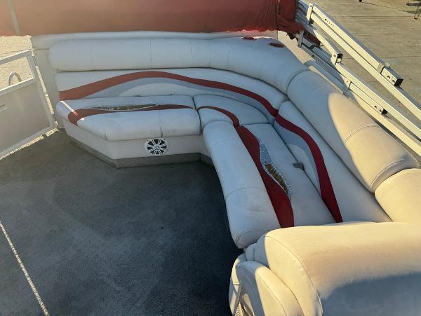 2005 Starcraft 22 Sport boat interior with beige and red seating.