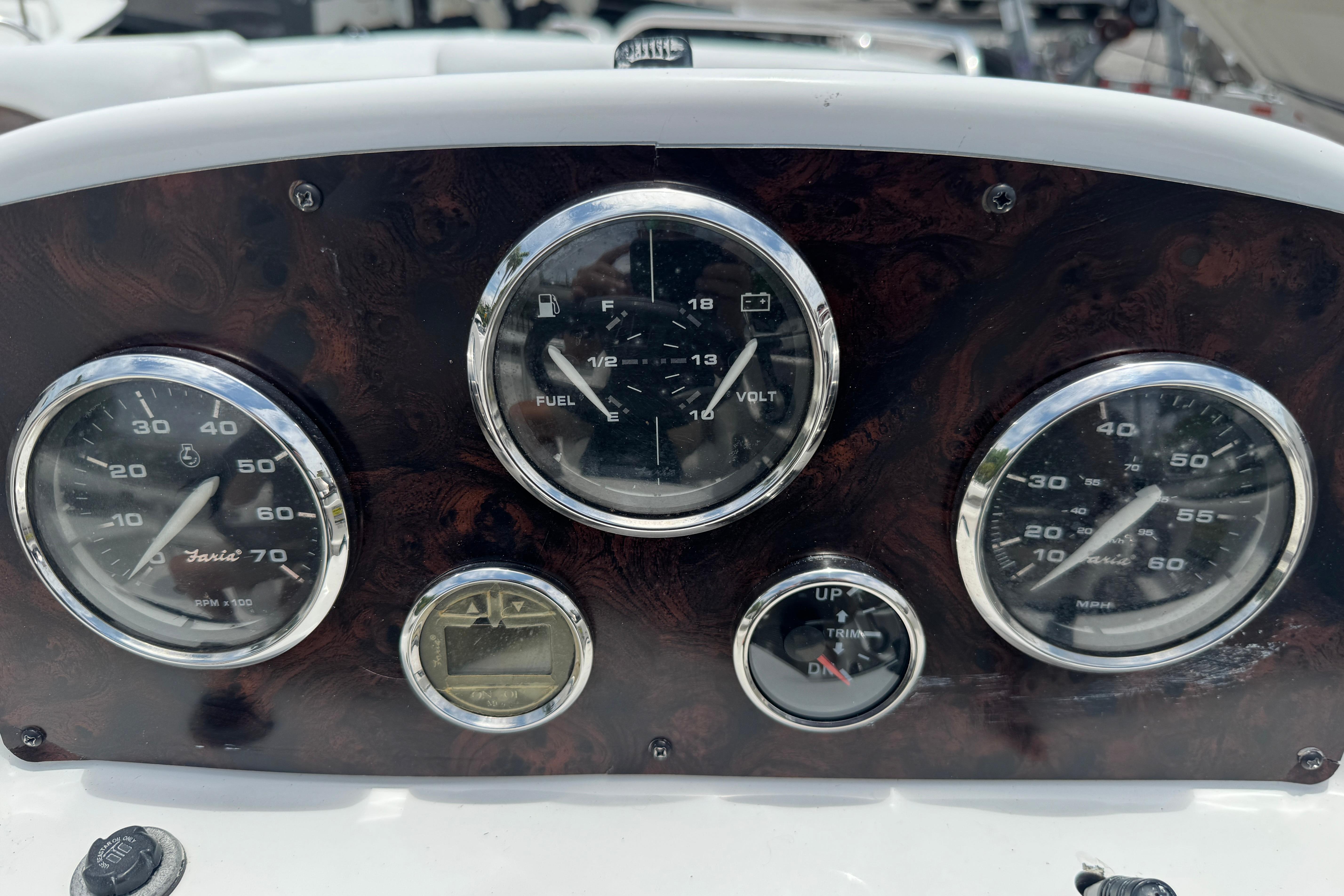Dashboard of a 2013 Hurricane SunDeck Sport 188 OB boat with gauges and controls.