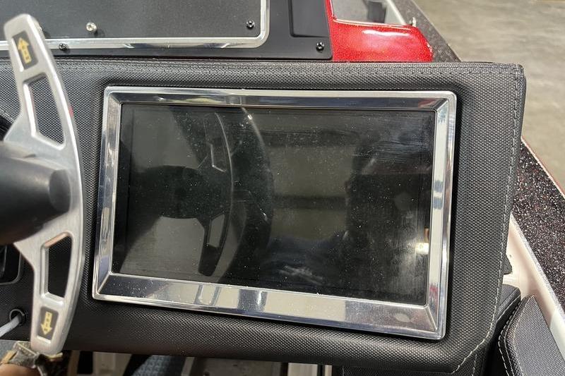 Dashboard of a 2022 Ranger Z520R boat with steering wheel and display screen.