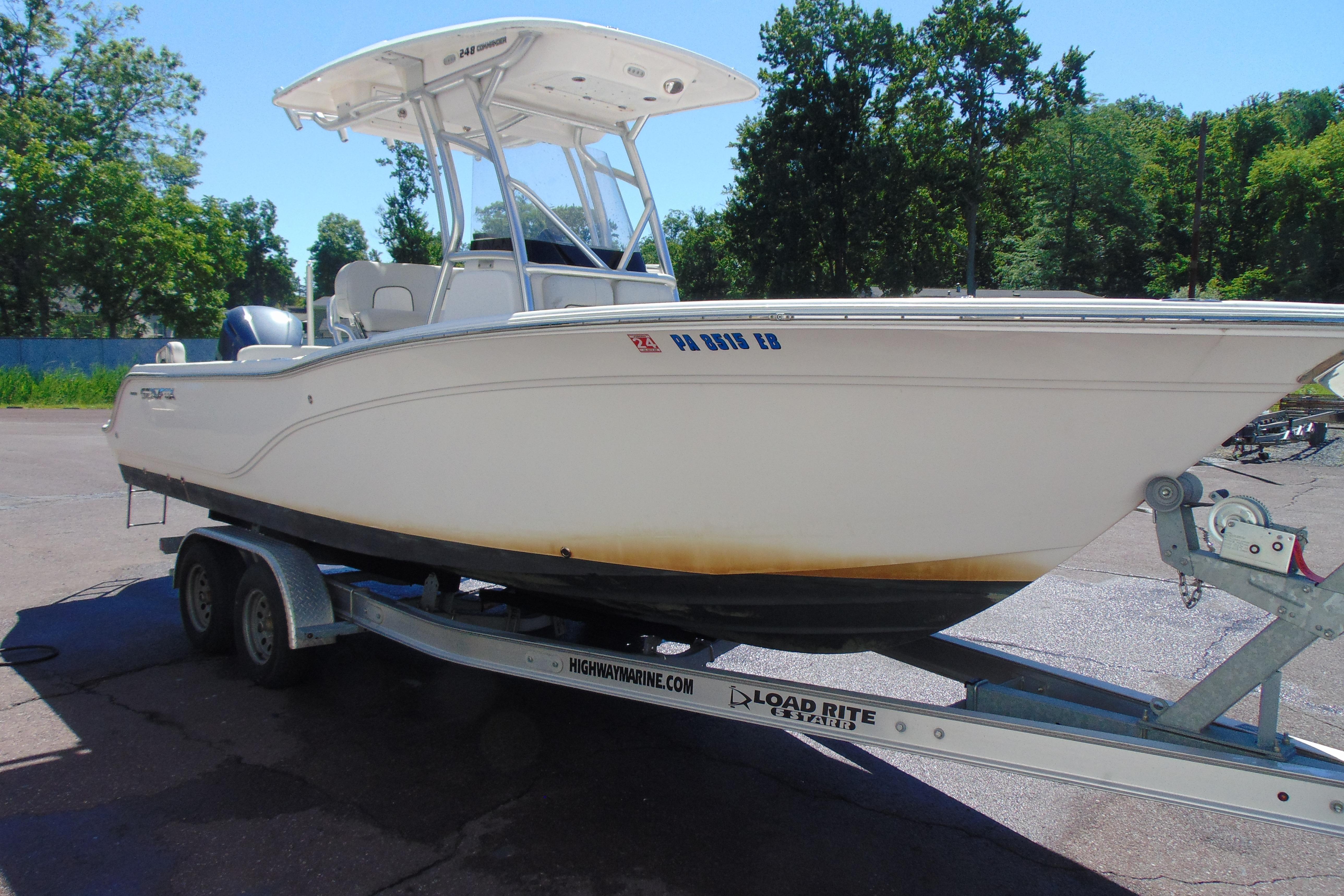 2022 Sea Fox 248 Commander boat on trailer, parked outdoors.