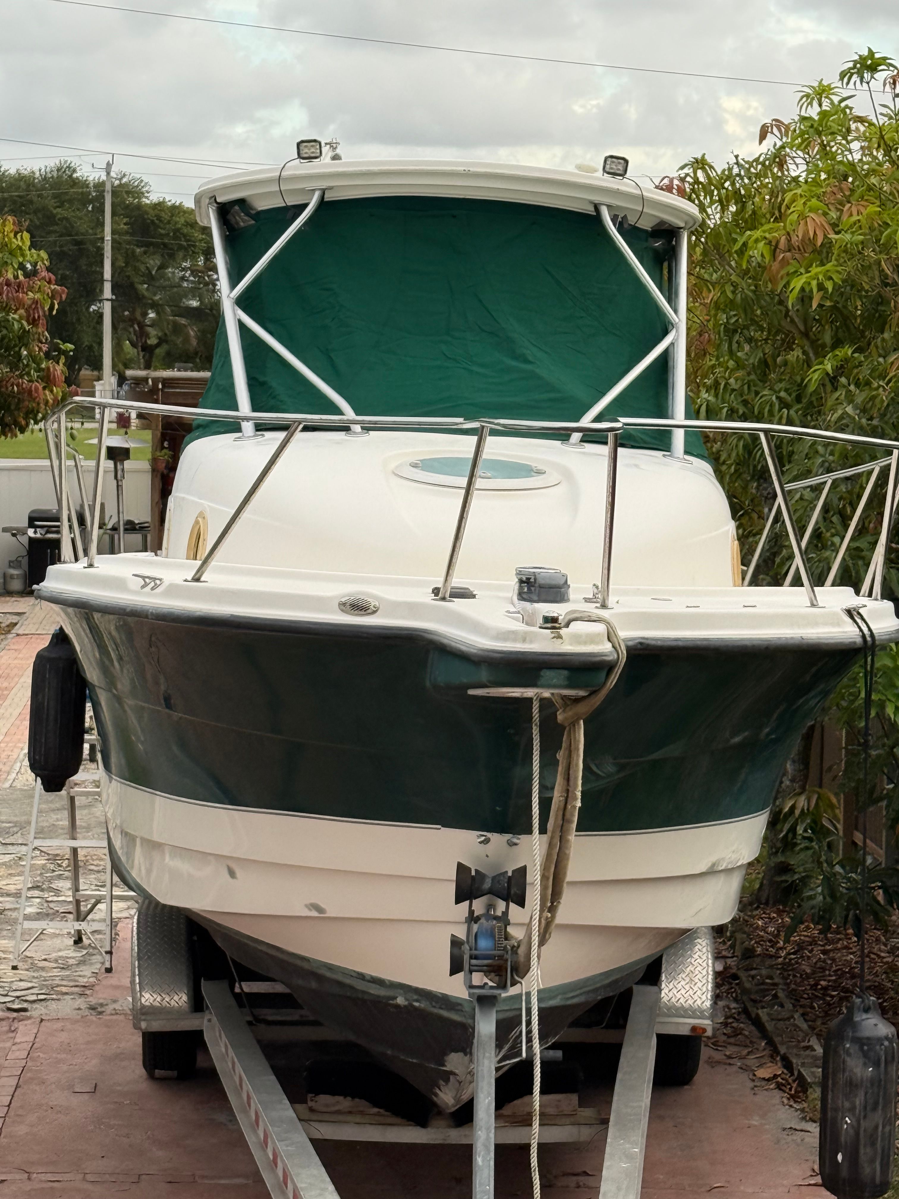 2005 Trophy 2902 Walkaround boat parked on trailer.
