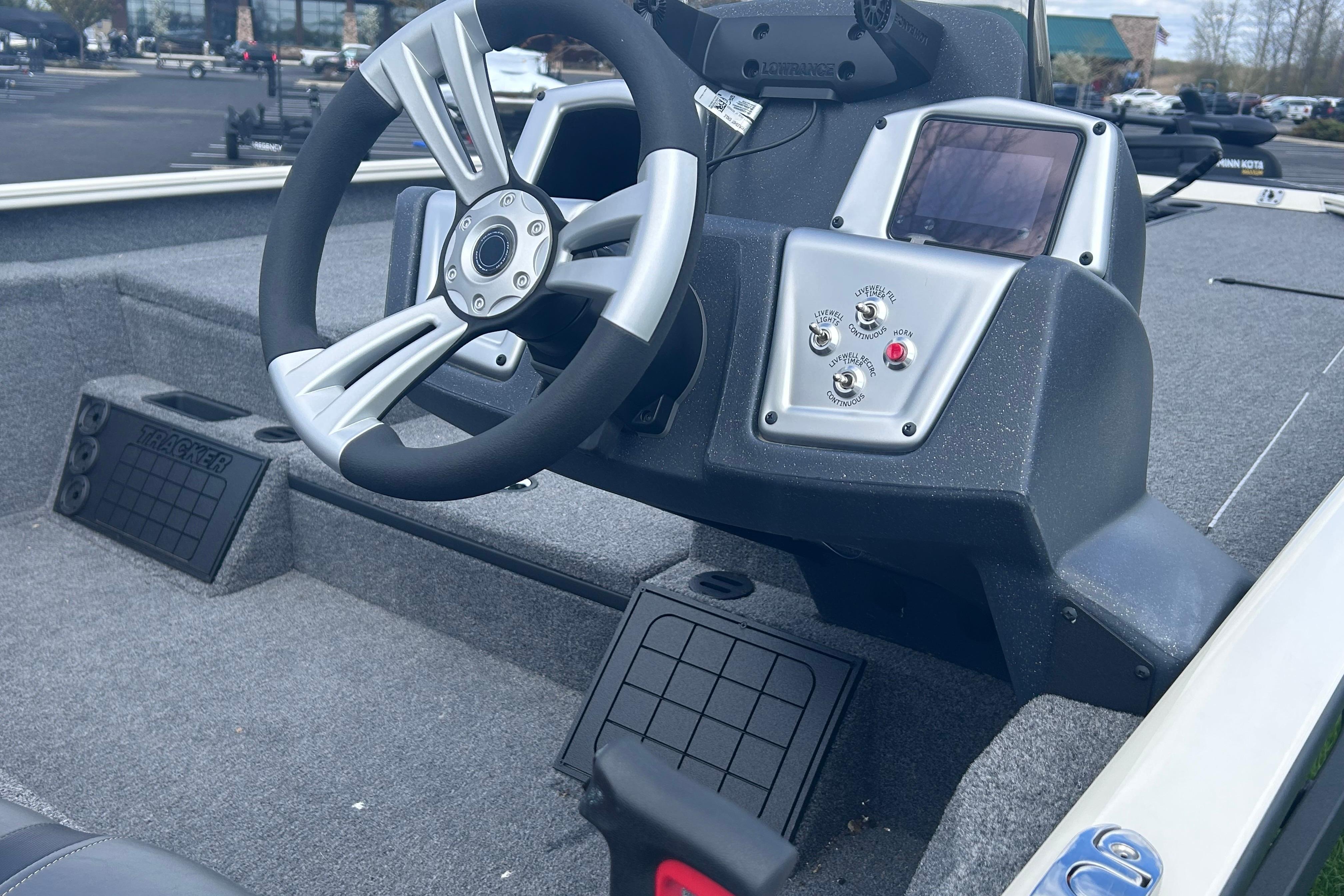 Steering console of 2025 Tracker Savage 215 boat with modern controls and display.