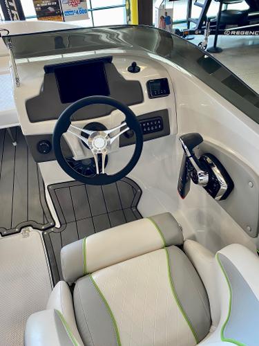 2023 Tahoe 210 Si Limited boat cockpit with steering wheel and control panel.
