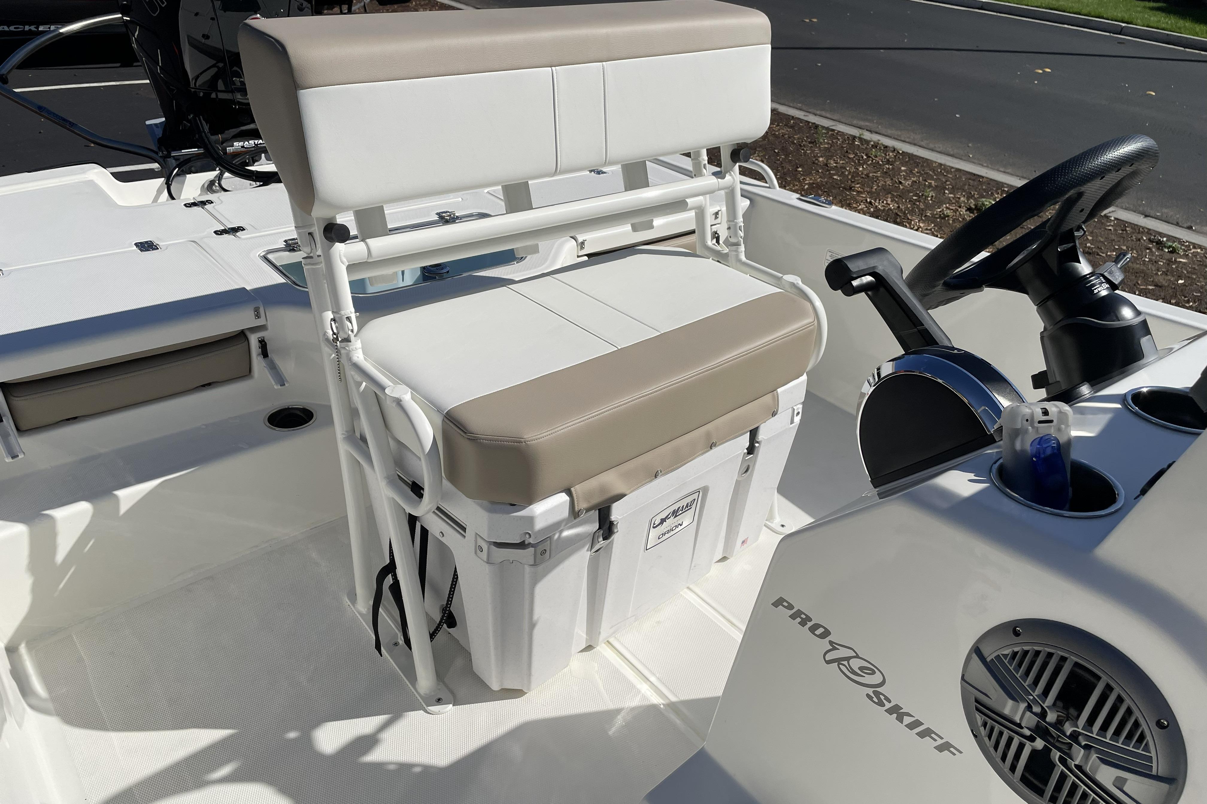 2026 Mako Pro Skiff 19 CC boat interior with seating and steering console.