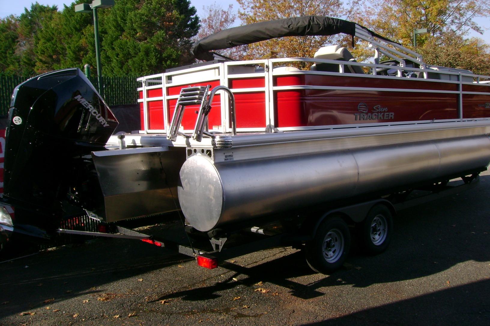 2026 Sun Tracker Fishin' Barge 22 XP3 pontoon boat with Mercury outboard motor.