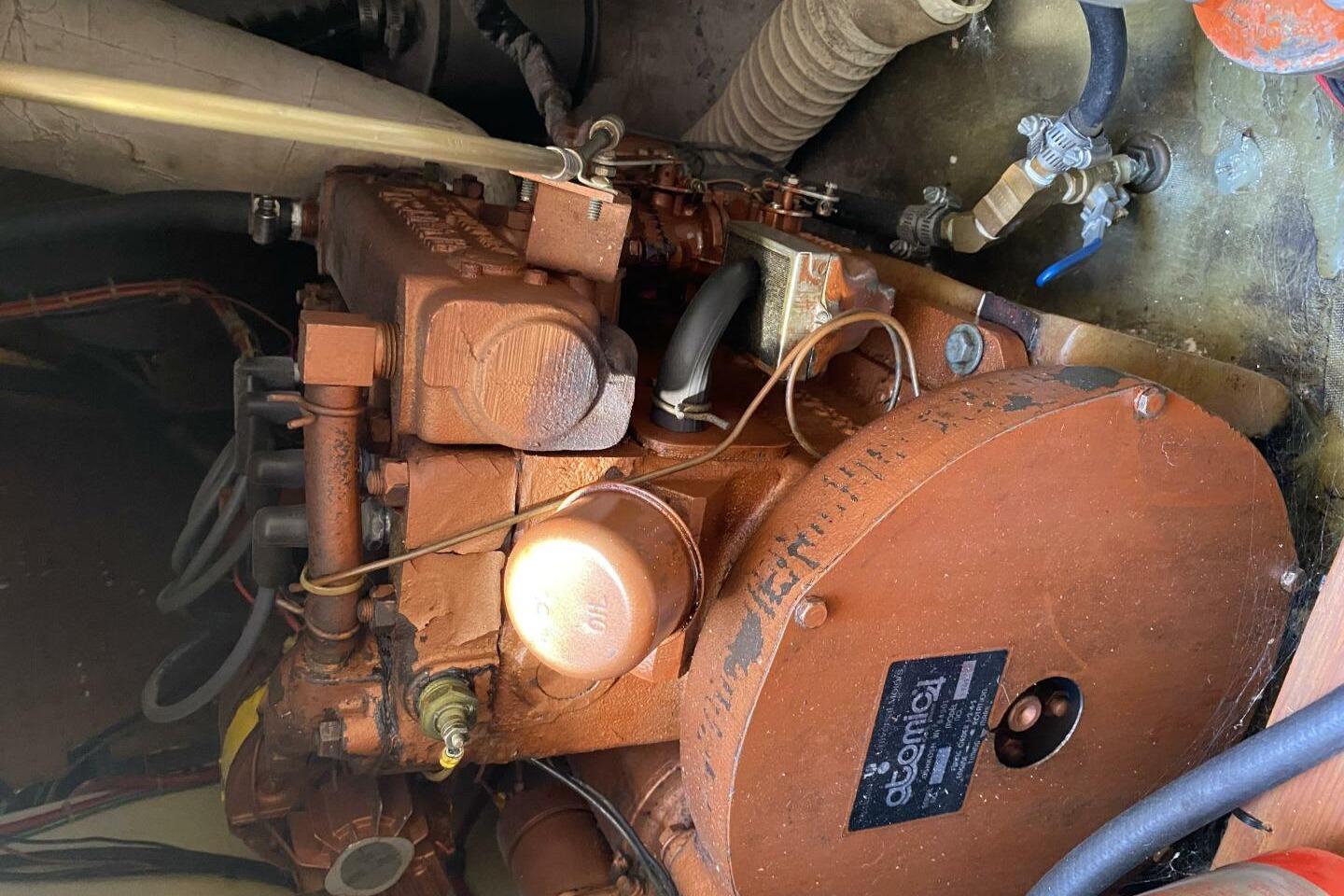 1977 Pearson 30 boat engine, Atomic 4 model, in a compact engine compartment.