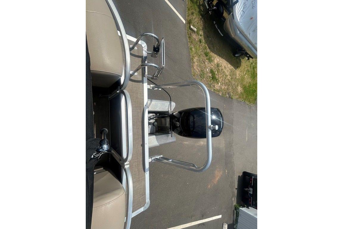 2023 Sun Tracker Party Barge 22 DLX pontoon boat, top view of seating and motor.