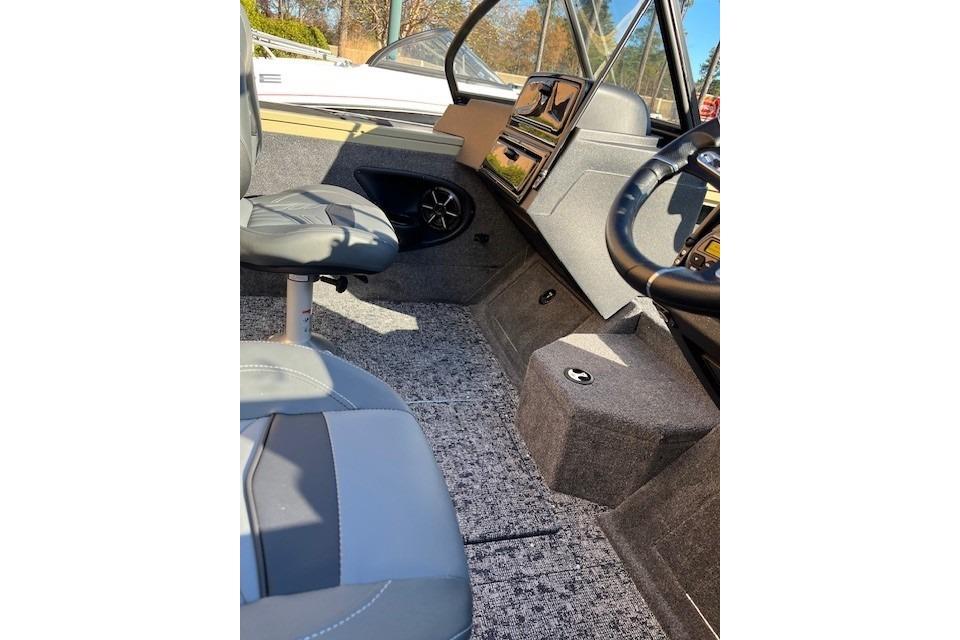 Interior of 2026 Tracker Targa V-18 Combo boat with seating and steering wheel.