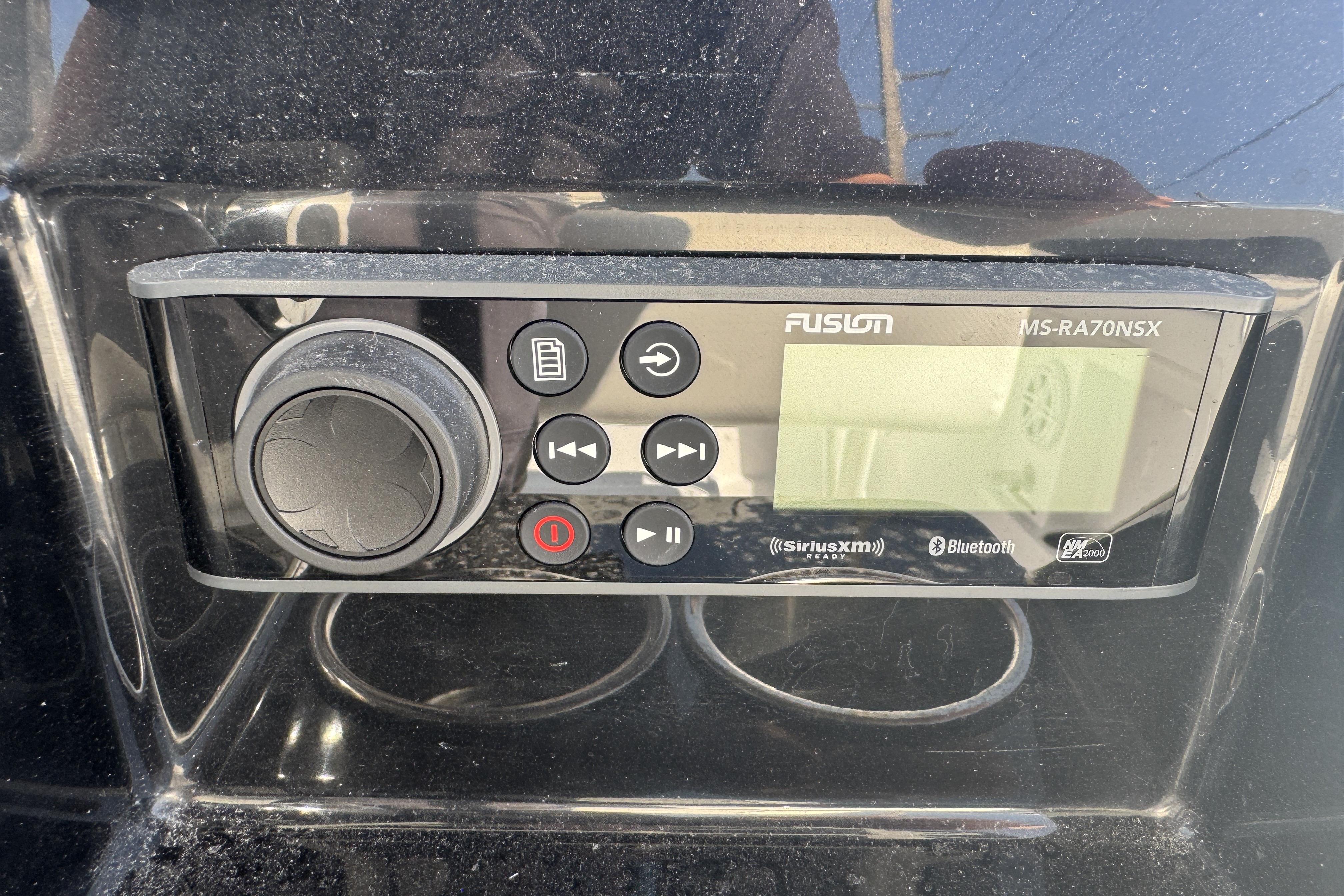 Fusion MS-RA70NSX stereo system on 2025 Wellcraft 242 Fisherman boat dashboard.
