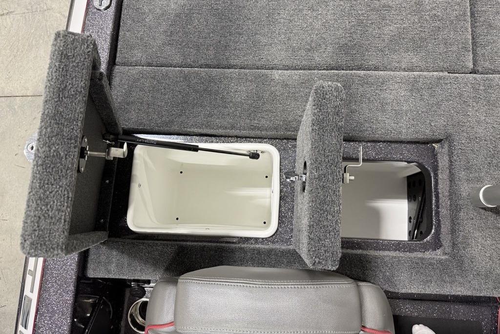 2025 Skeeter ZX150 boat storage compartments with open lids, showcasing interior space.