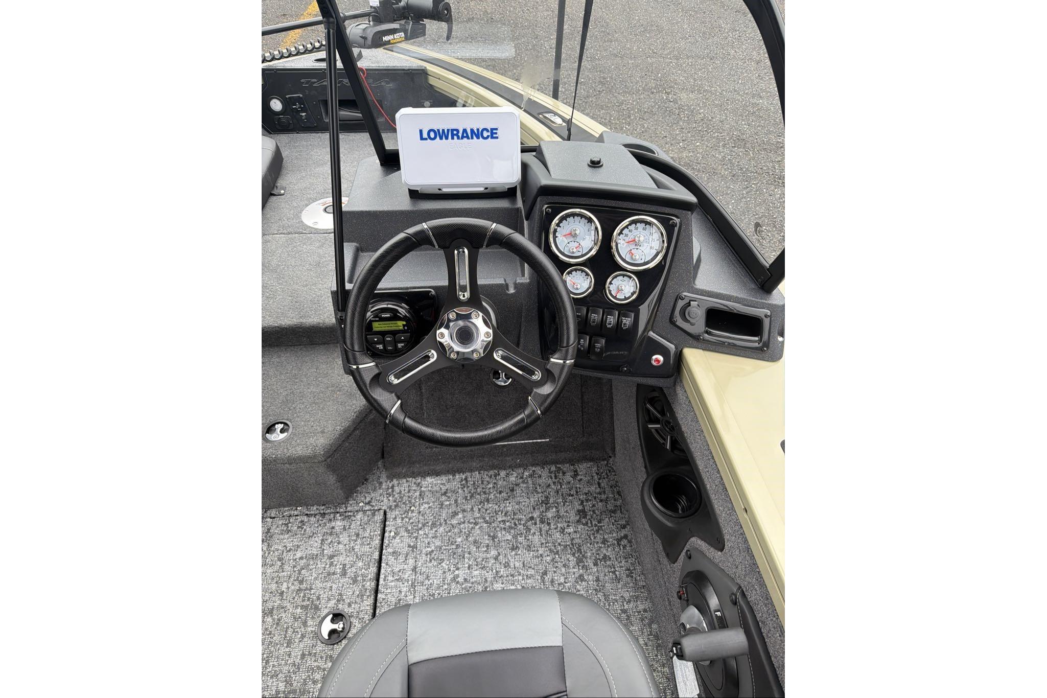 2026 Tracker Targa V-18 Combo boat dashboard with steering wheel and Lowrance display.