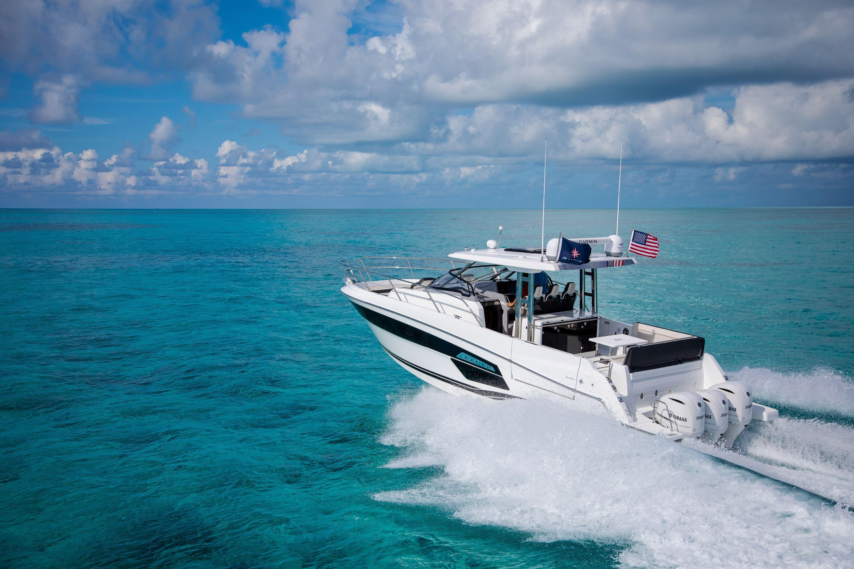 2026 Jeanneau Leader 12.5 WA cruising on clear turquoise ocean waters.