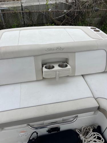2013 Sea Ray 240 Sundeck boat interior with cup holders and seating.