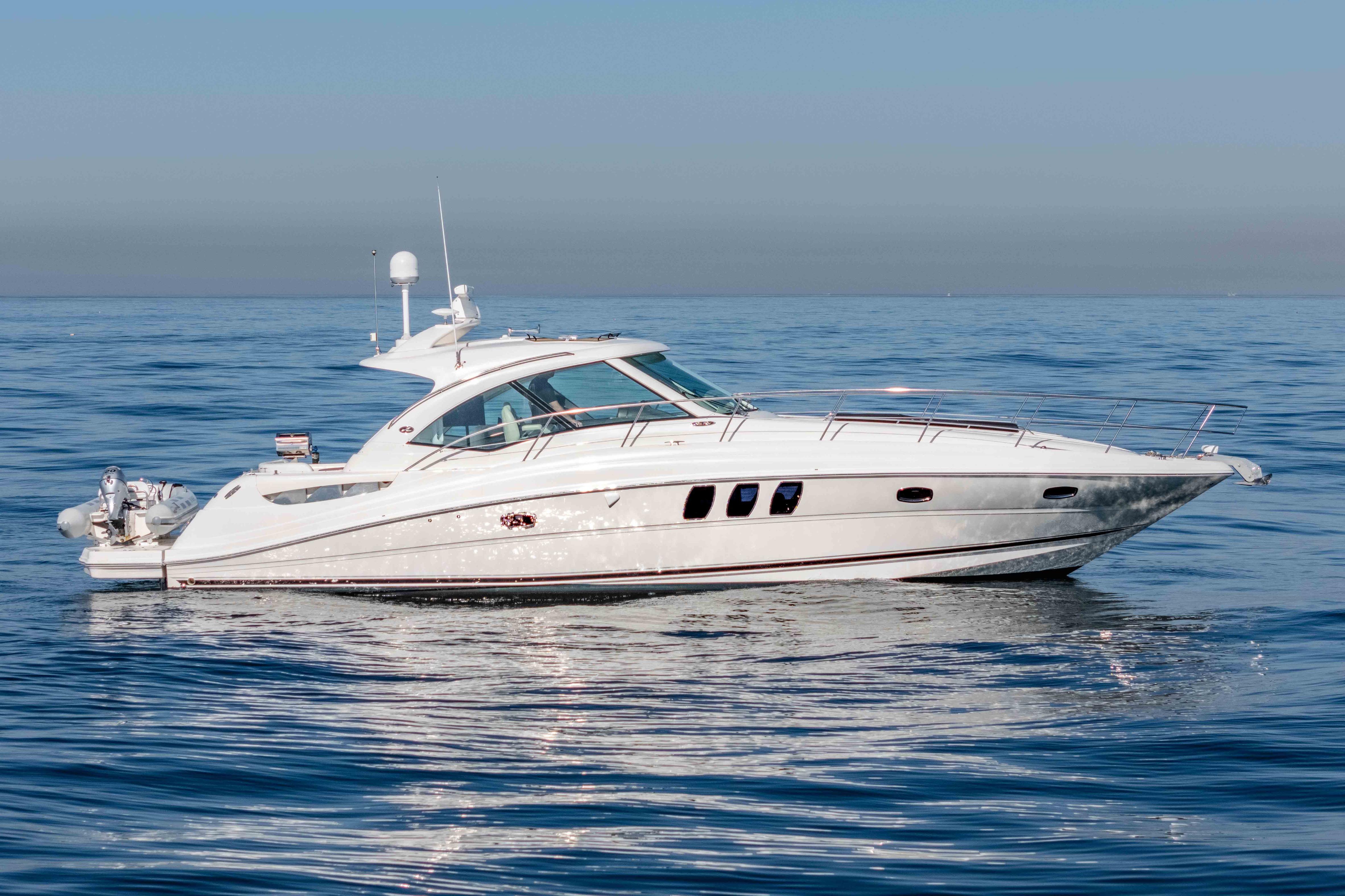 2007 Sea Ray 48 Sundancer yacht cruising on calm ocean waters.