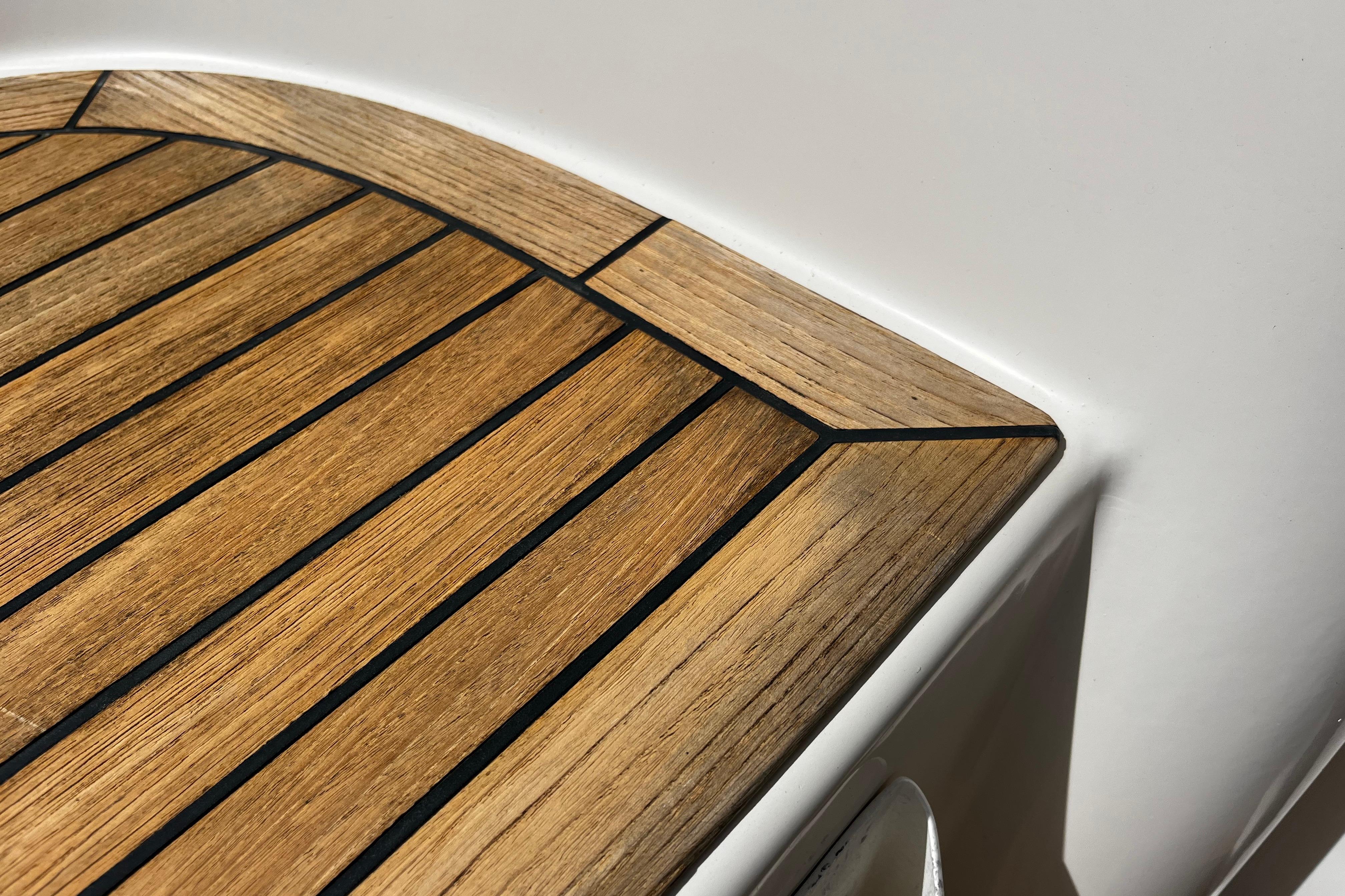 Teak deck detail on 2004 Hanse 411 yacht, showcasing elegant wood craftsmanship.